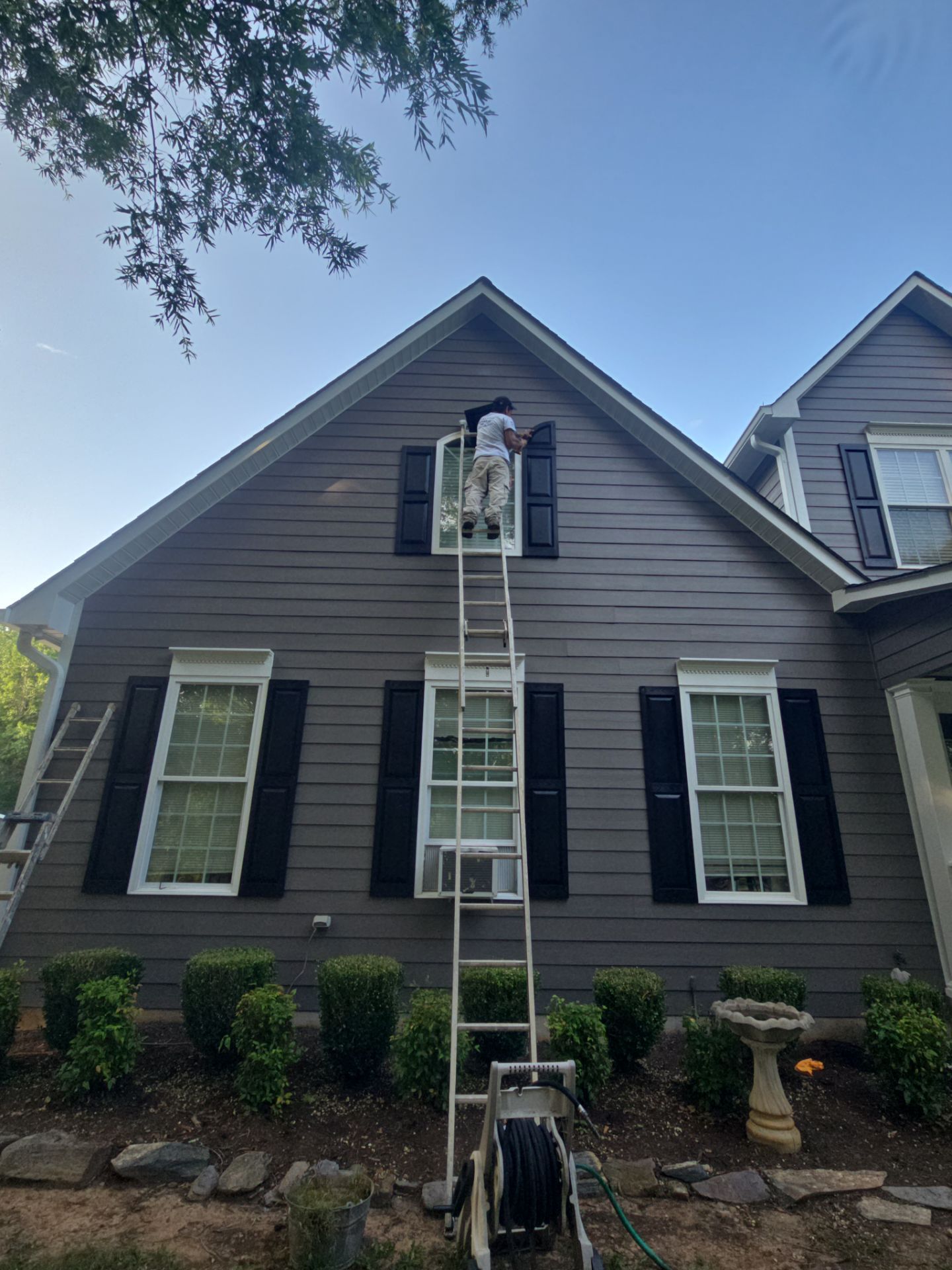 Siding replacement, exterior painting, and front door staining. by GonzalezPainters & Contractors Inc