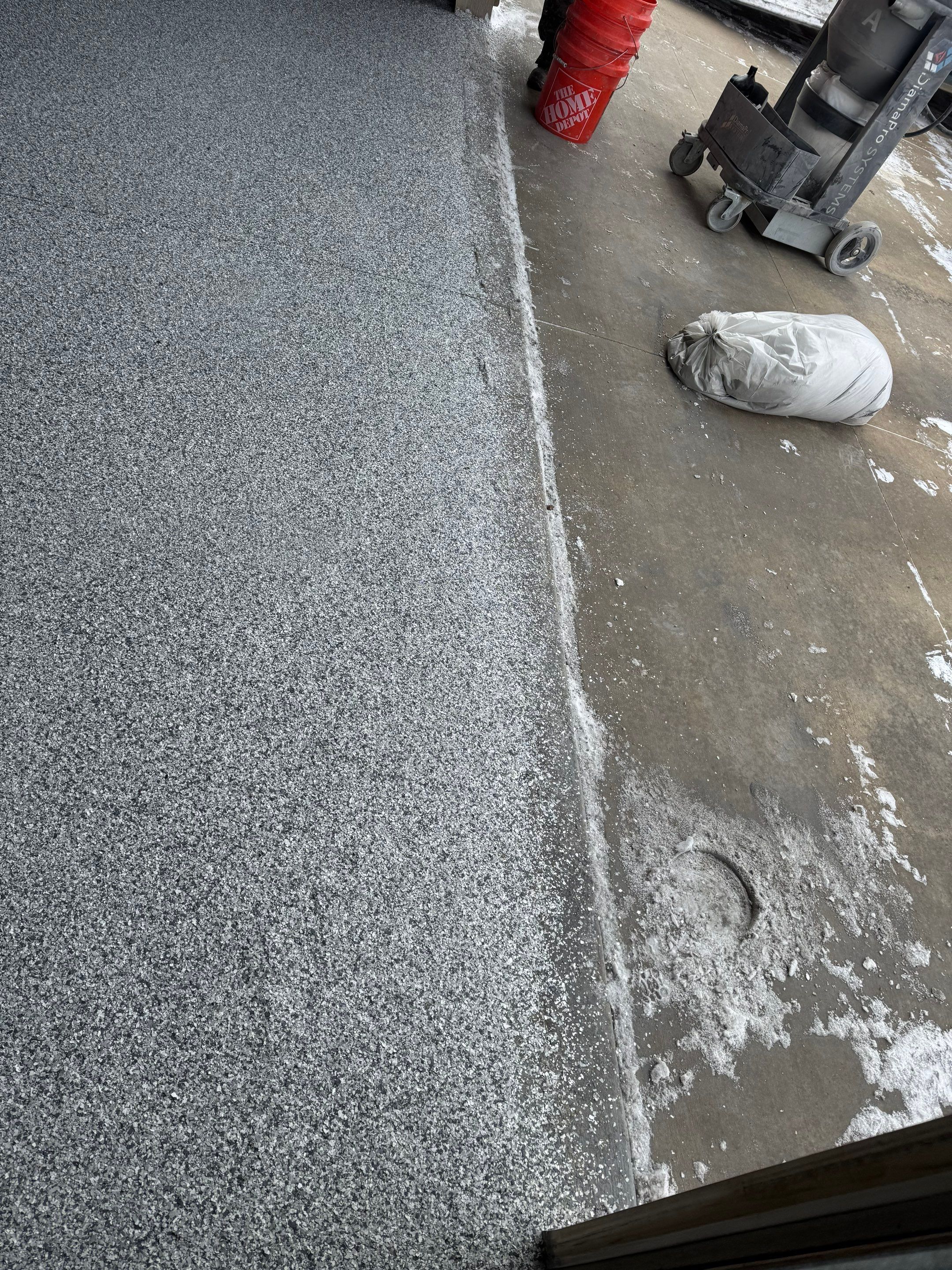 Grey Speckled Epoxy Garage Floor and Stair Coating in Sioux Falls by Select Painting, Coatings & Garage Cabinets