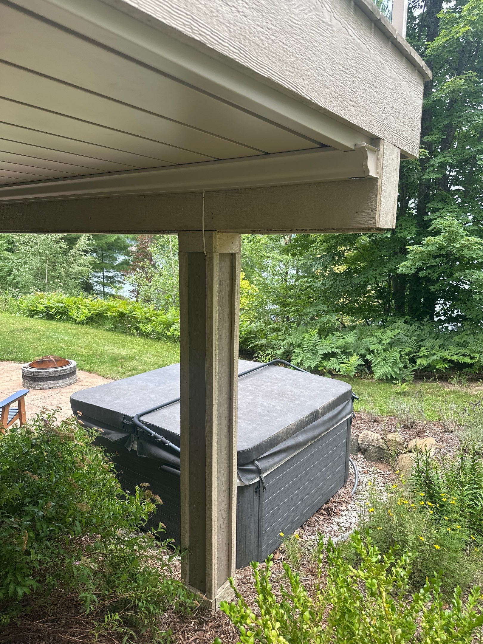 Traverse City Underdecking Installation with Integrated Seamless Gutter System by Rainbow Seamless Systems