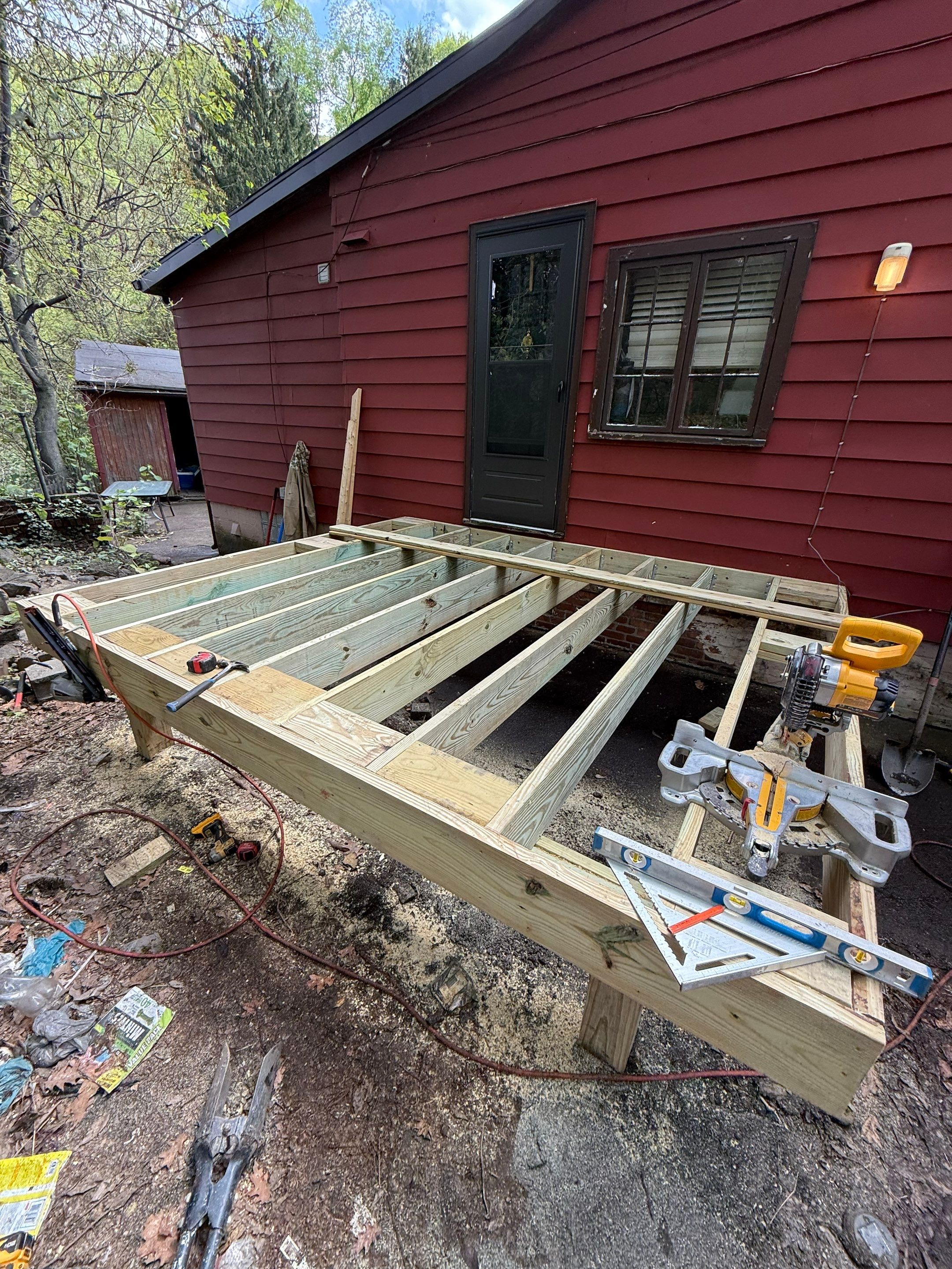 Roof sunspace deck  by Cousins Roofing Siding & Decks