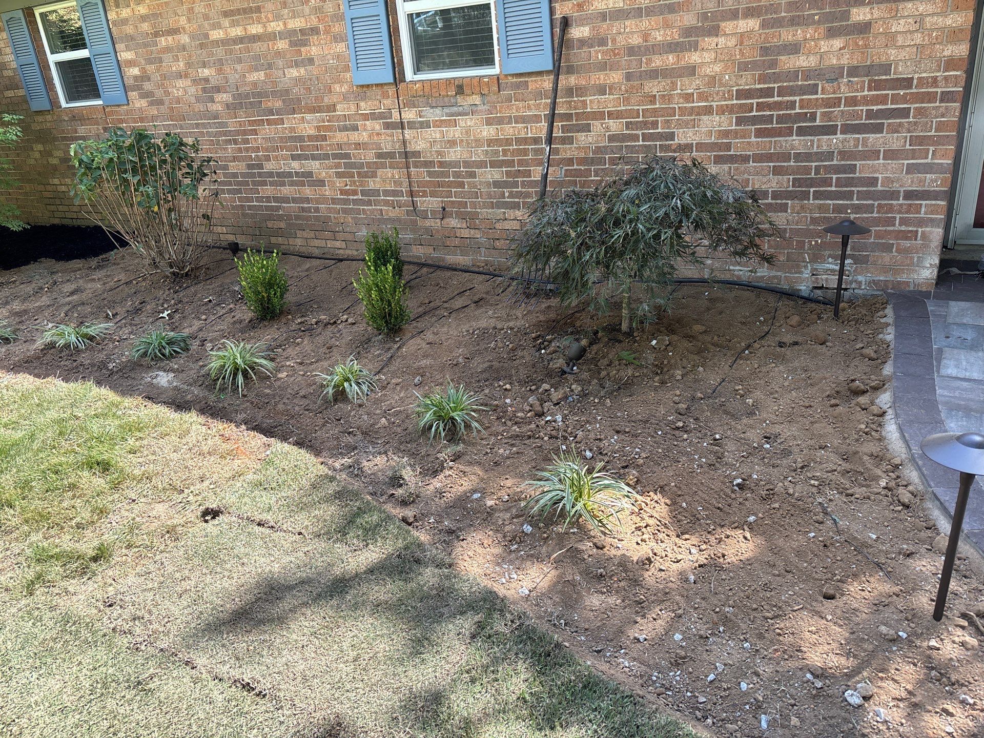 Front Entry Enhancements and a Back Deck Upgrade by Elite Proscapes LLC