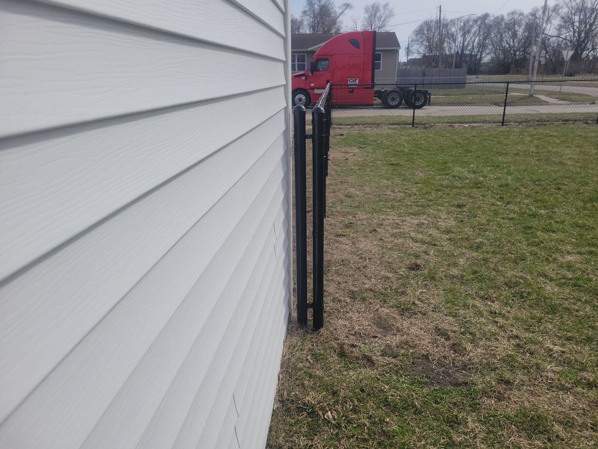 Black Chain Link Fence and Gate Installation in Waterloo by Perfect Picket Fence and Stain