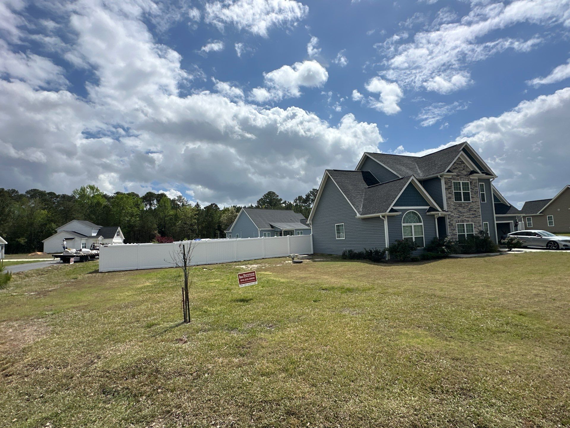 White Vinyl Privacy Fence Installation in Clinton by Superior Fence and Rail