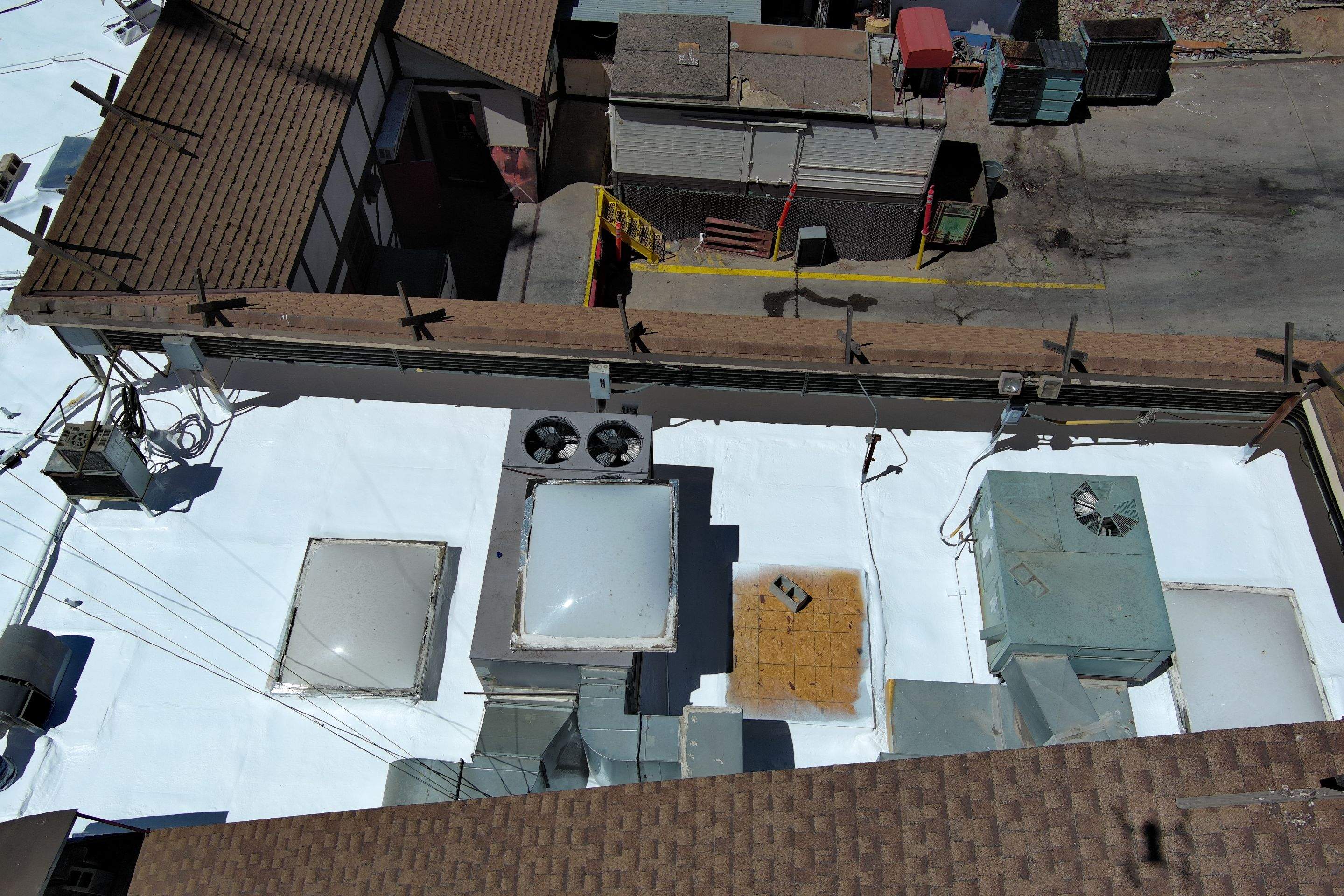 Spray foam and coatings using General Coatings acrylic coatings and spray foam by Straight Edge Roofing Inc