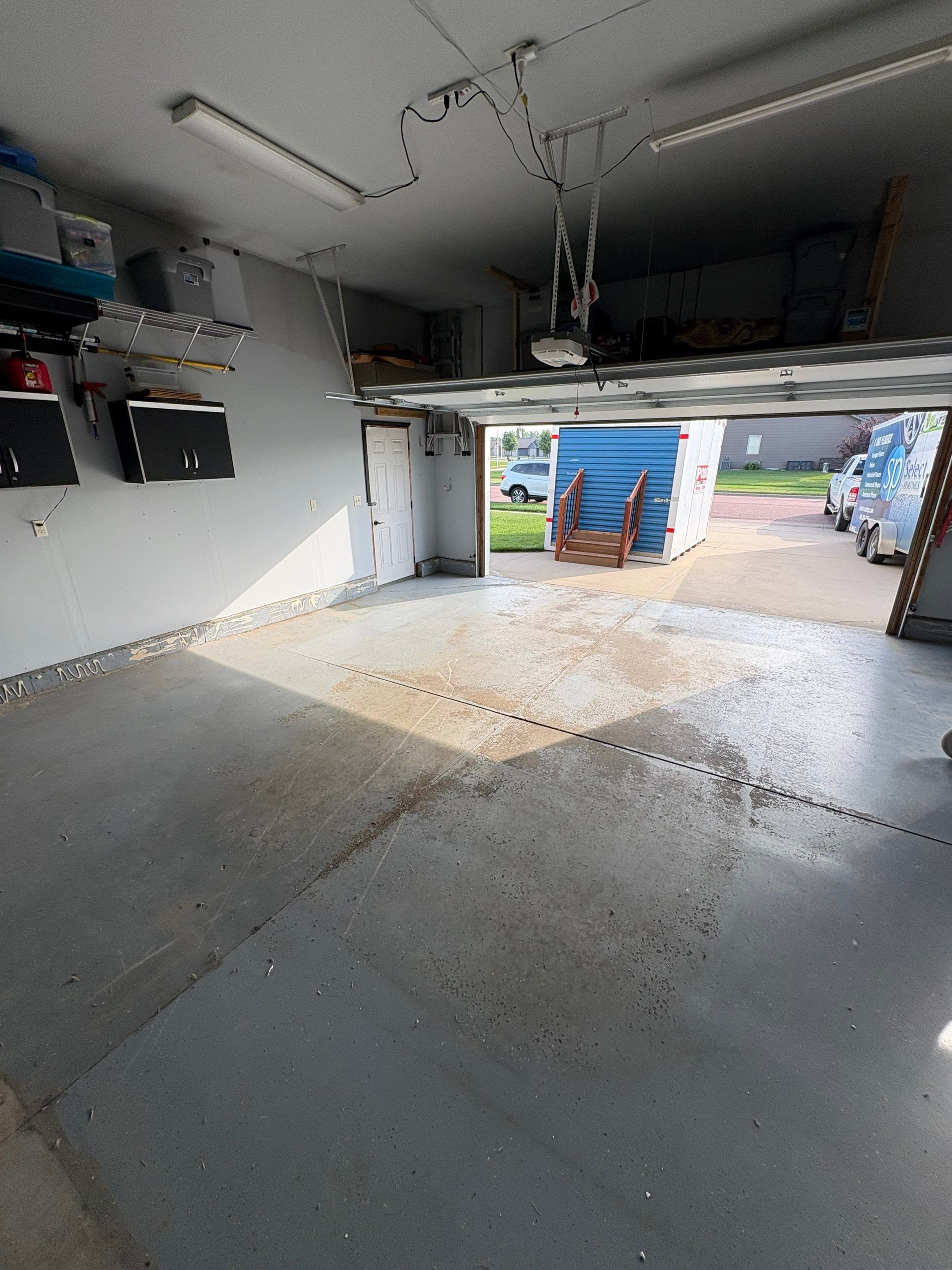 Sioux Falls Garage Concrete Coating Installation with Domino Flake by Select Painting, Coatings & Garage Cabinets