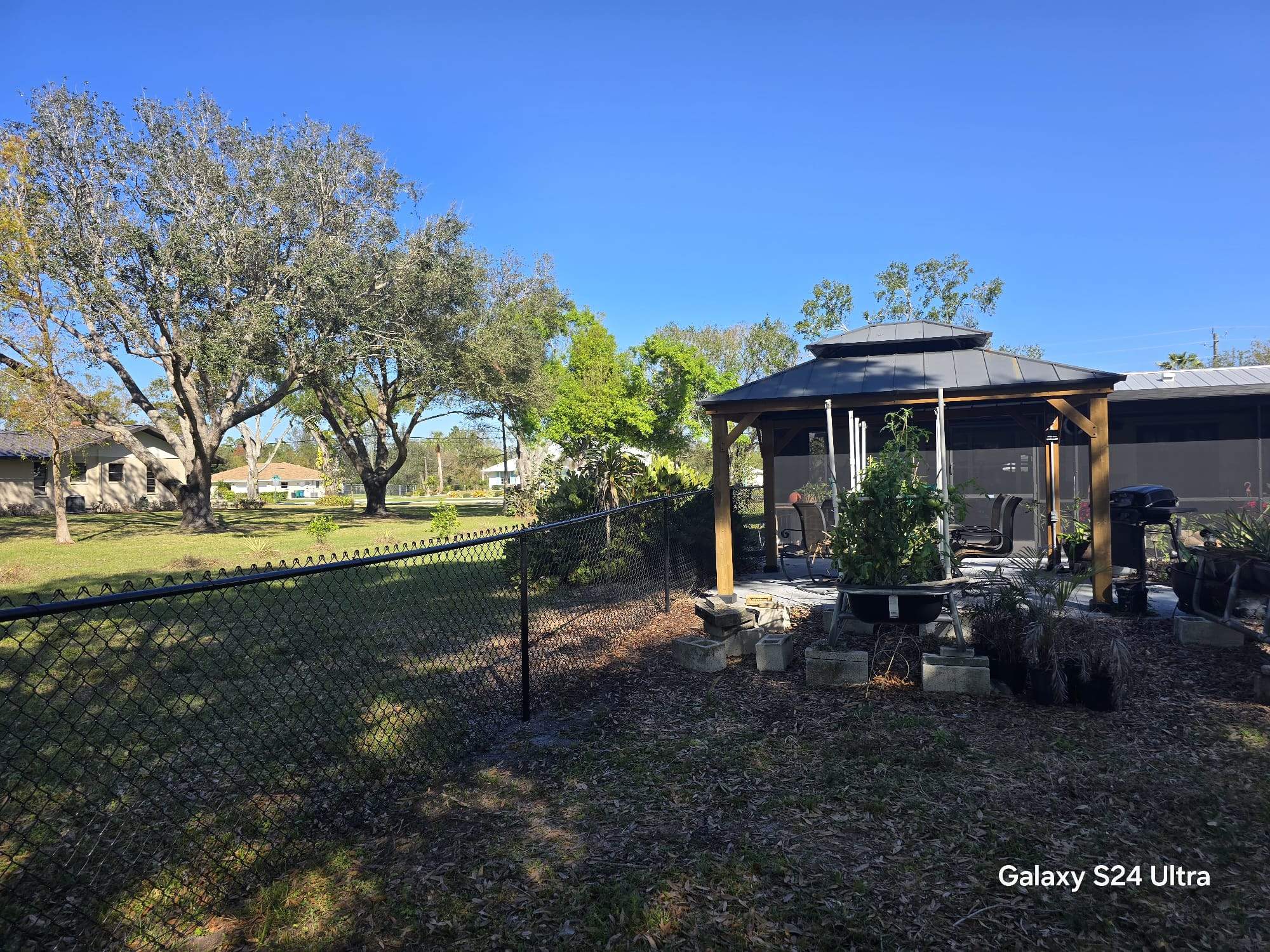 Black Chain Link Fence Installation in Port Charlotte by True Fence LLC