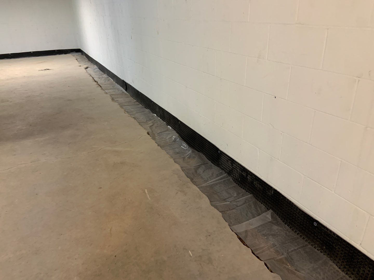 Correcting an Improper Installation for Alan in Chanhassen by Waterproofing Northeast