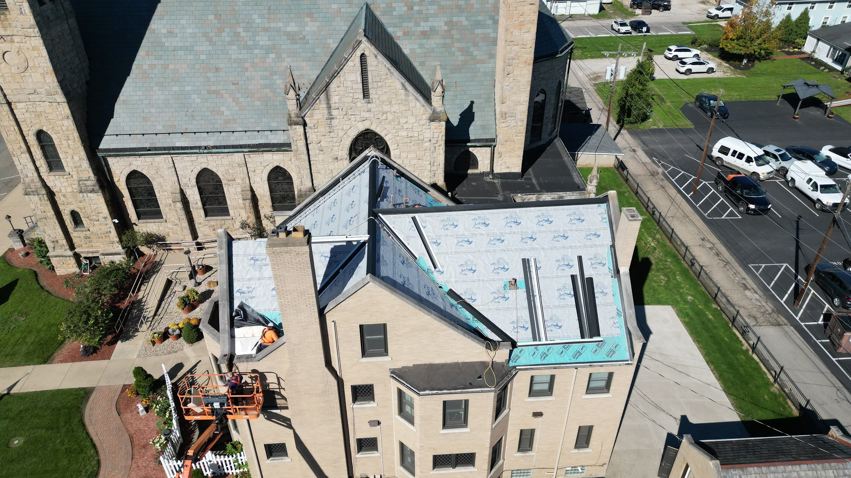 Commercial Roofing Installation using Standing Seam Metal - Frost Black by RoofX 
