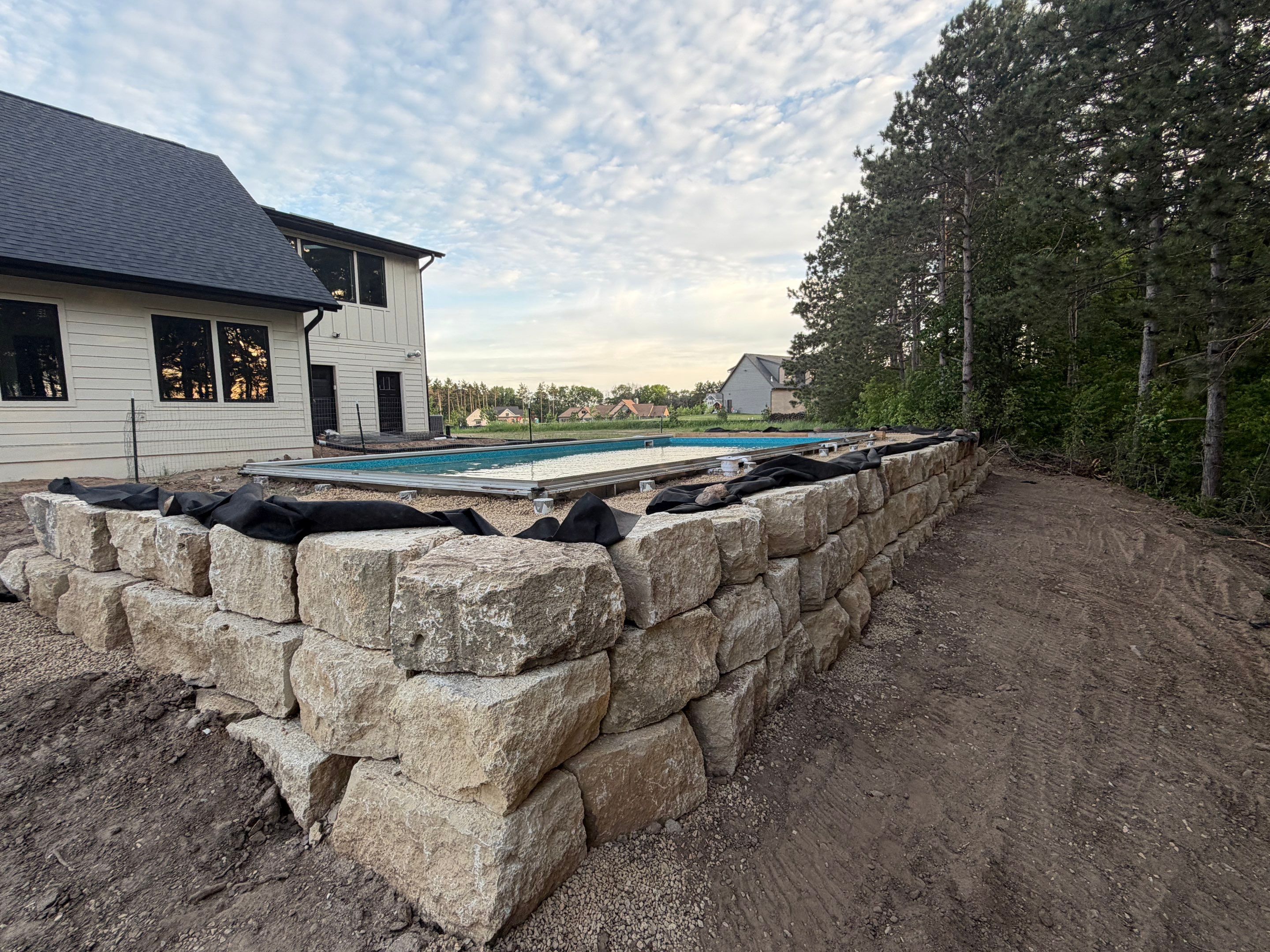 Limestone Boulder Wall by Sota landscaping