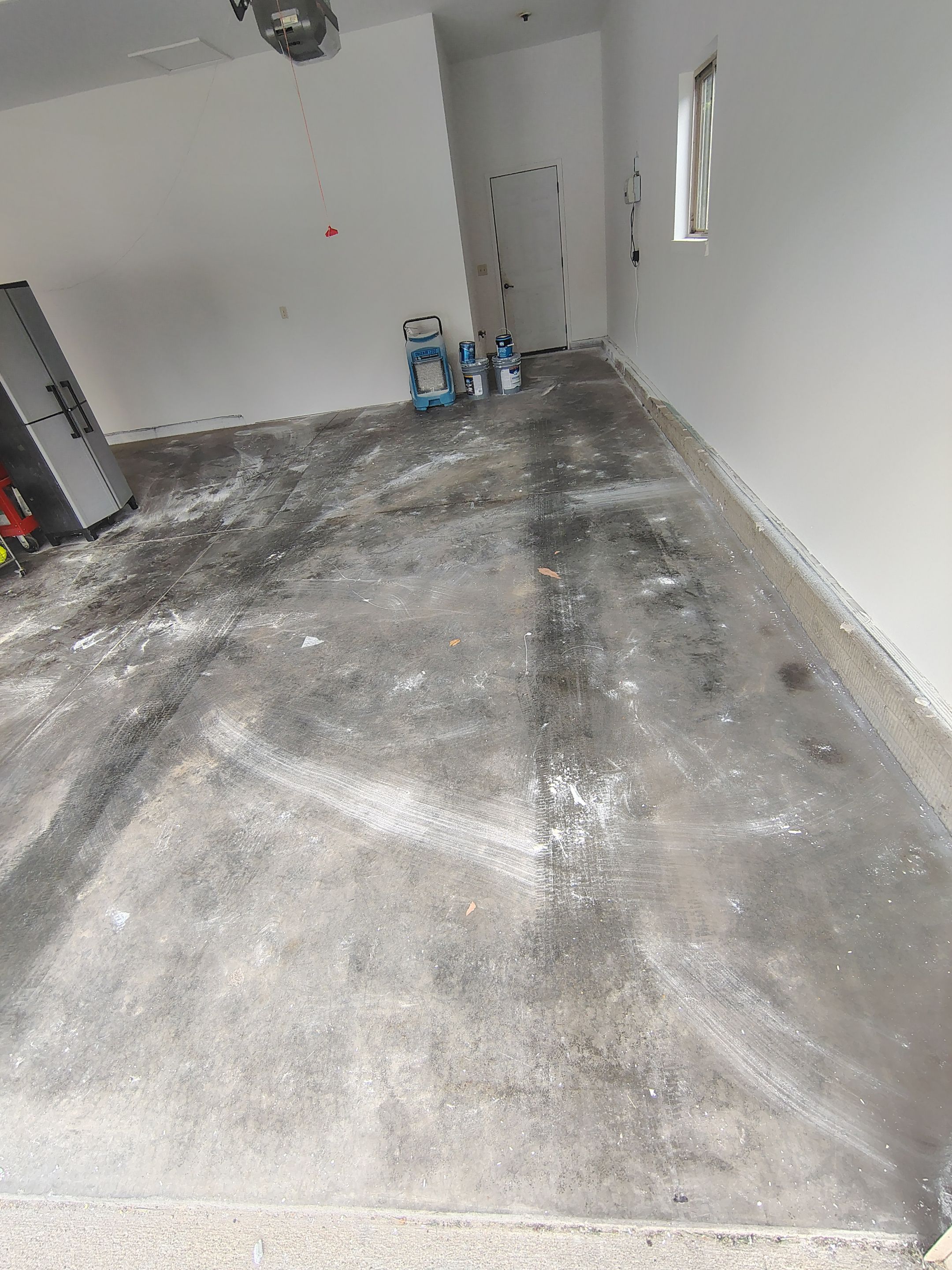 Custom Grey Speckled Epoxy Floor Coating for Sioux Falls Garage by Select Painting, Coatings & Garage Cabinets