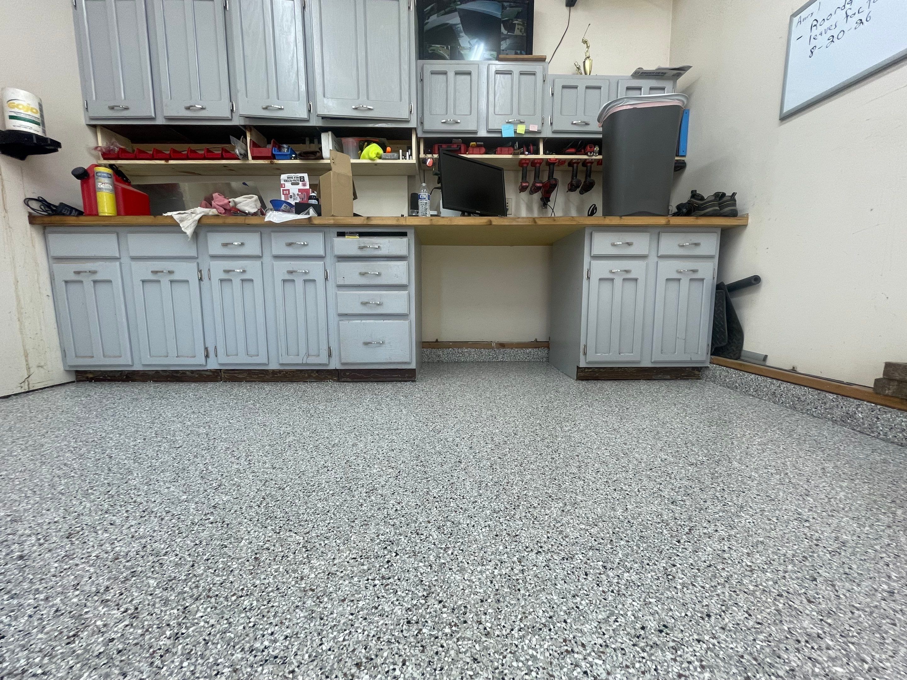 Multi-Stall Garage Floor Coating Installation in Sioux Falls by Select Painting, Coatings & Garage Cabinets