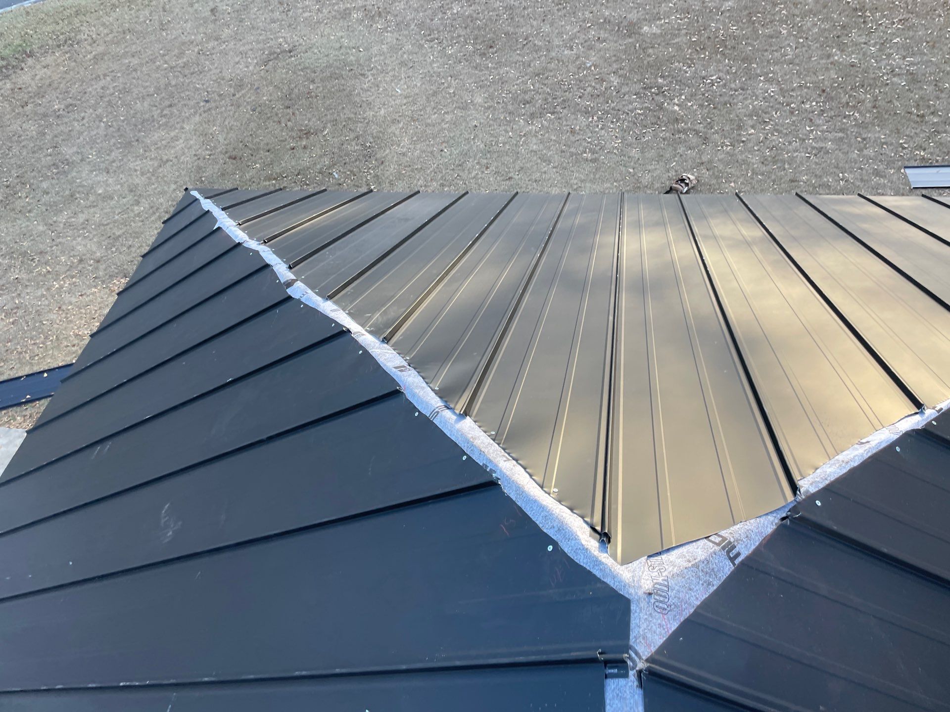 Residential Roofing Installation using Benton 26Ga 1inc Snapcock Metal Roof KYNAR Matte Black by Talya Roofing