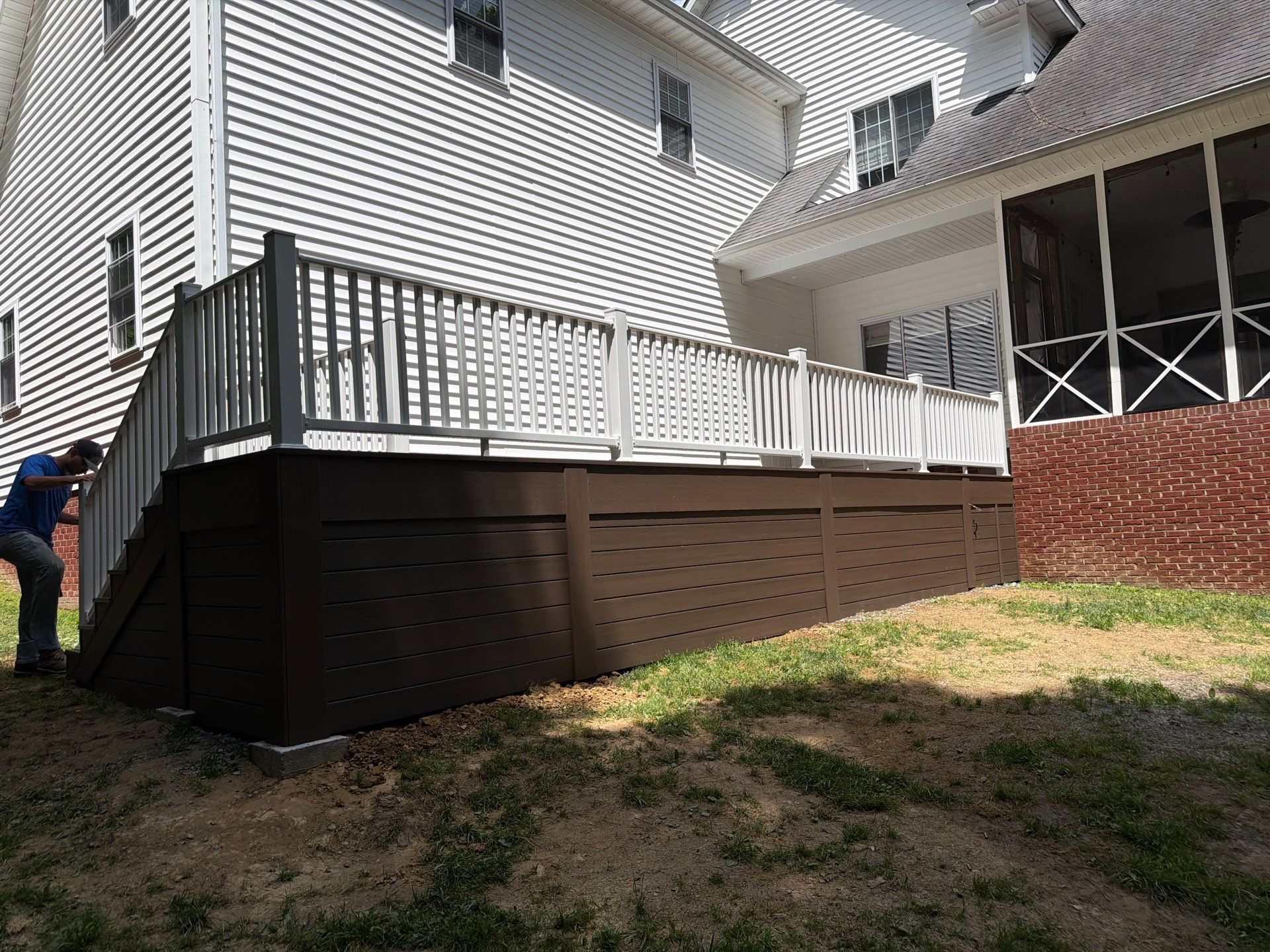 Custom Composite Deck and White Vinyl Railing Installation in Fayetteville by Walnut Hollow Decks & Outdoor Living