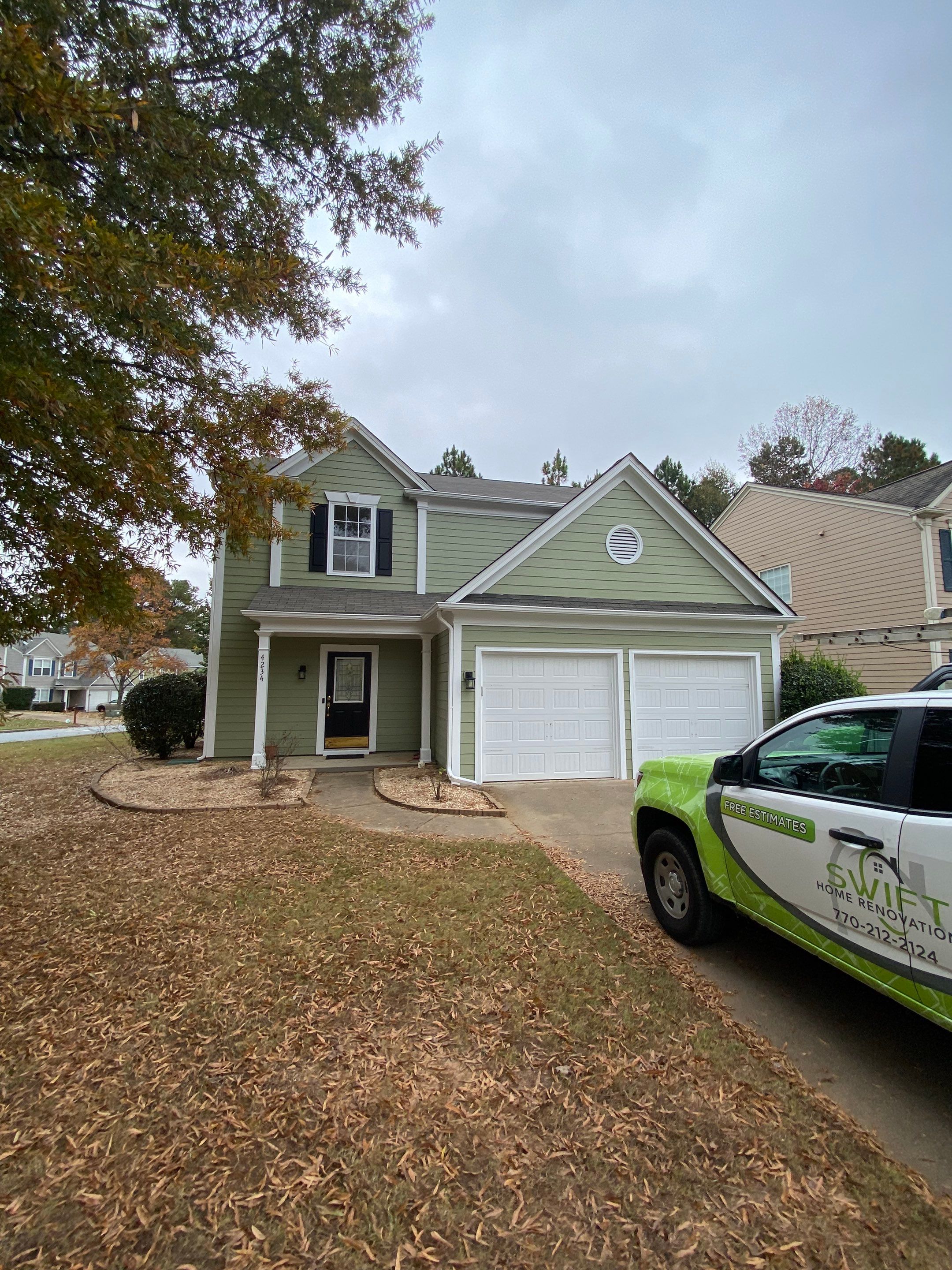 Exterior Painting for a Two-Story Sage Green Home in Kennesaw by Swift Home Renovations