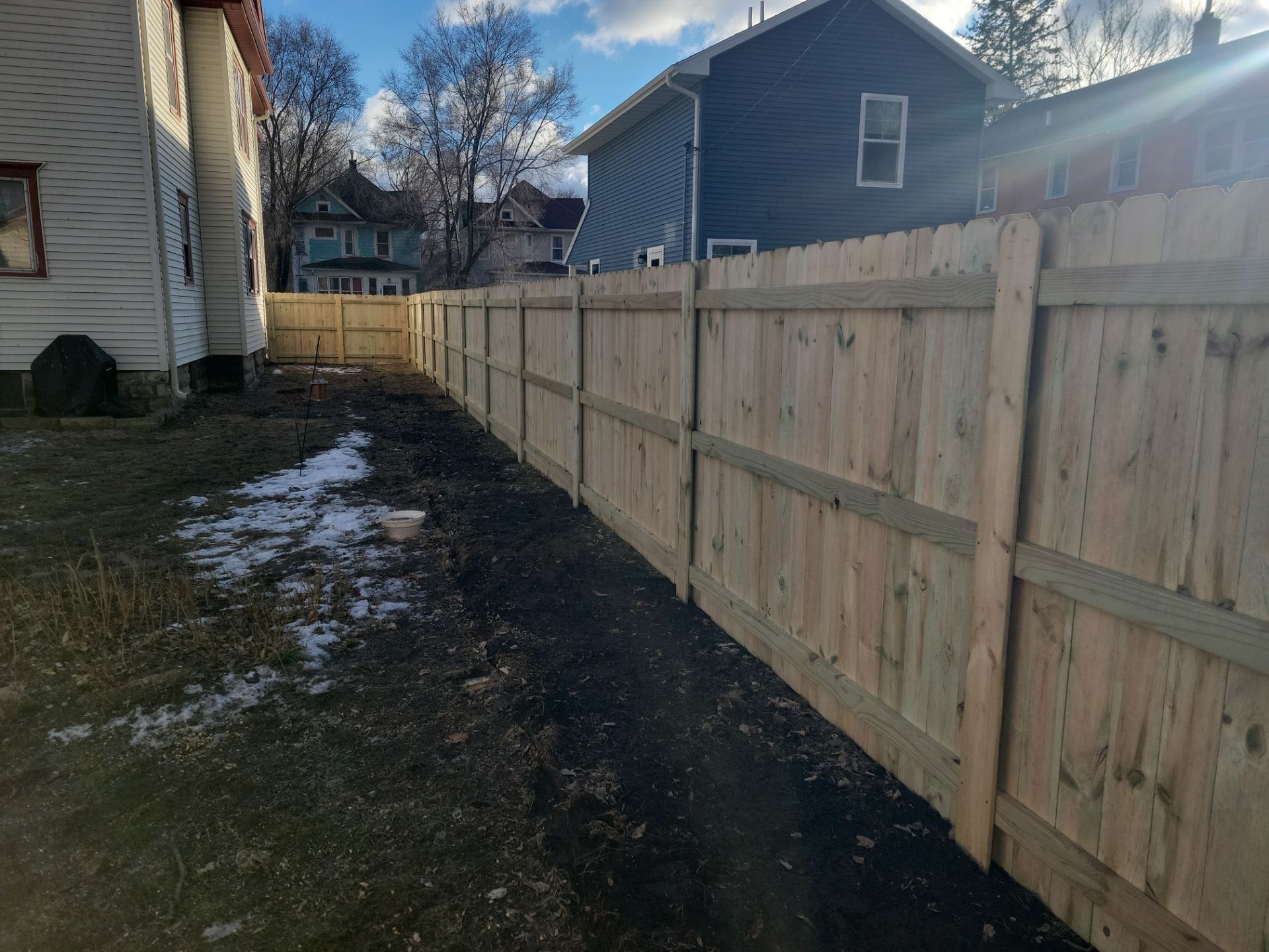 Pressure-Treated Wood Privacy Fence and Double Gate Installation in Waterloo by Perfect Picket Fence and Stain