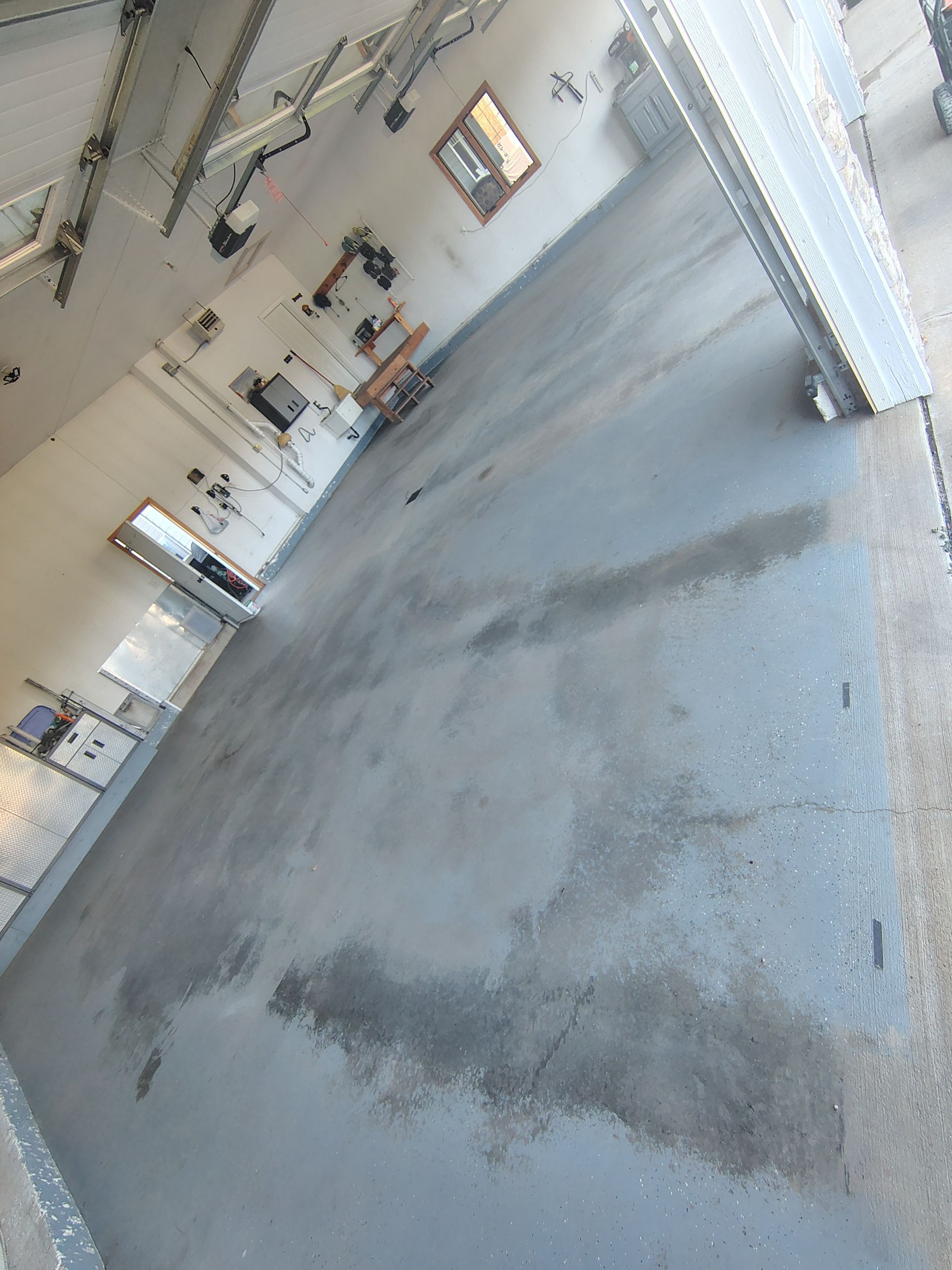 Feather Grey Garage Floor Coating Installation in Valley Springs by Select Painting, Coatings & Garage Cabinets
