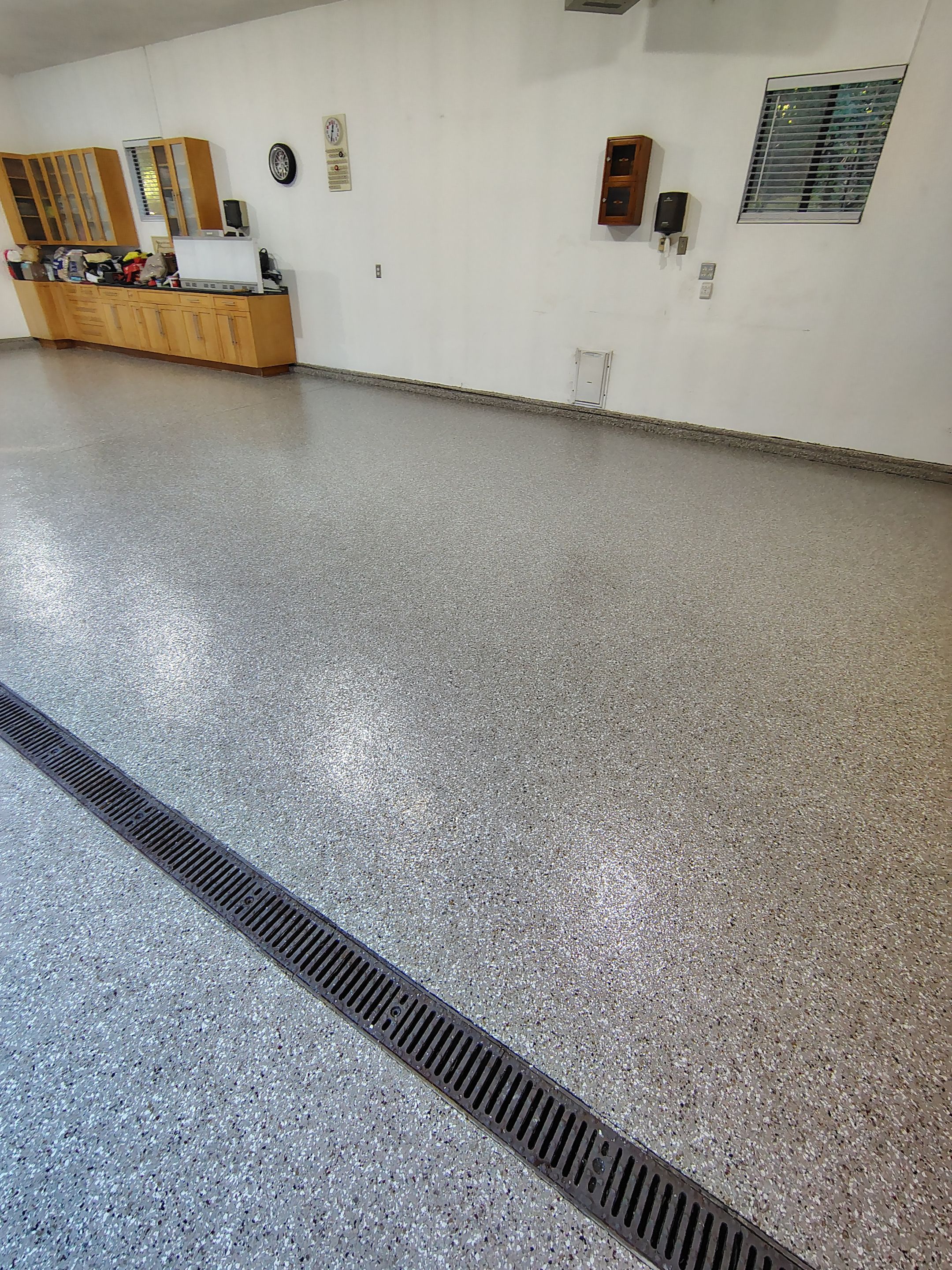 Garage Floor and Entry Step Concrete Coating in Sioux Falls by Select Painting, Coatings & Garage Cabinets