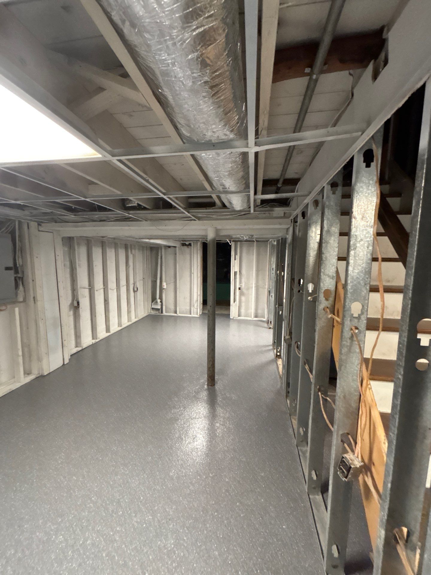 Basement Concrete Floor Coating with Penntek Flake System by Spectrum Painting, LLC