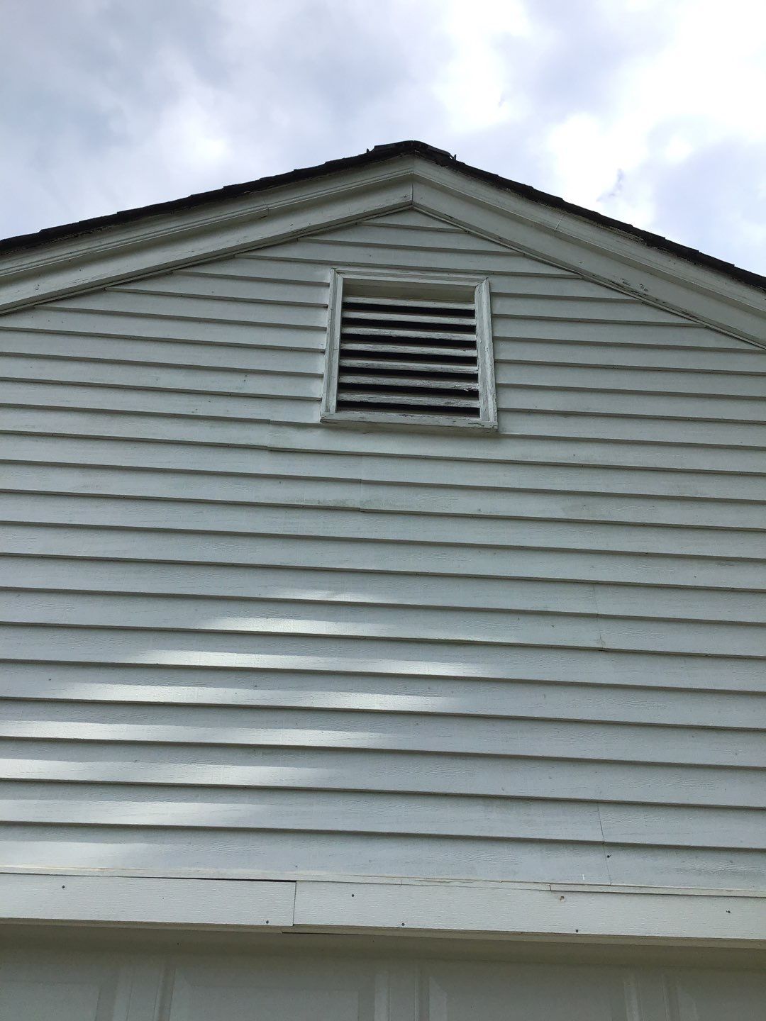 James Hardie Siding  using James Hardie Board and Batten, White by Absolute Roofing and Construction