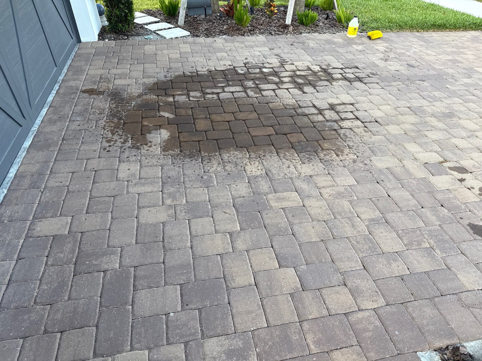 Oil Stain Removal on Paver Driveway | Esplanade at Artisan Lakes, Palmetto FL by Sunshine AquaWash