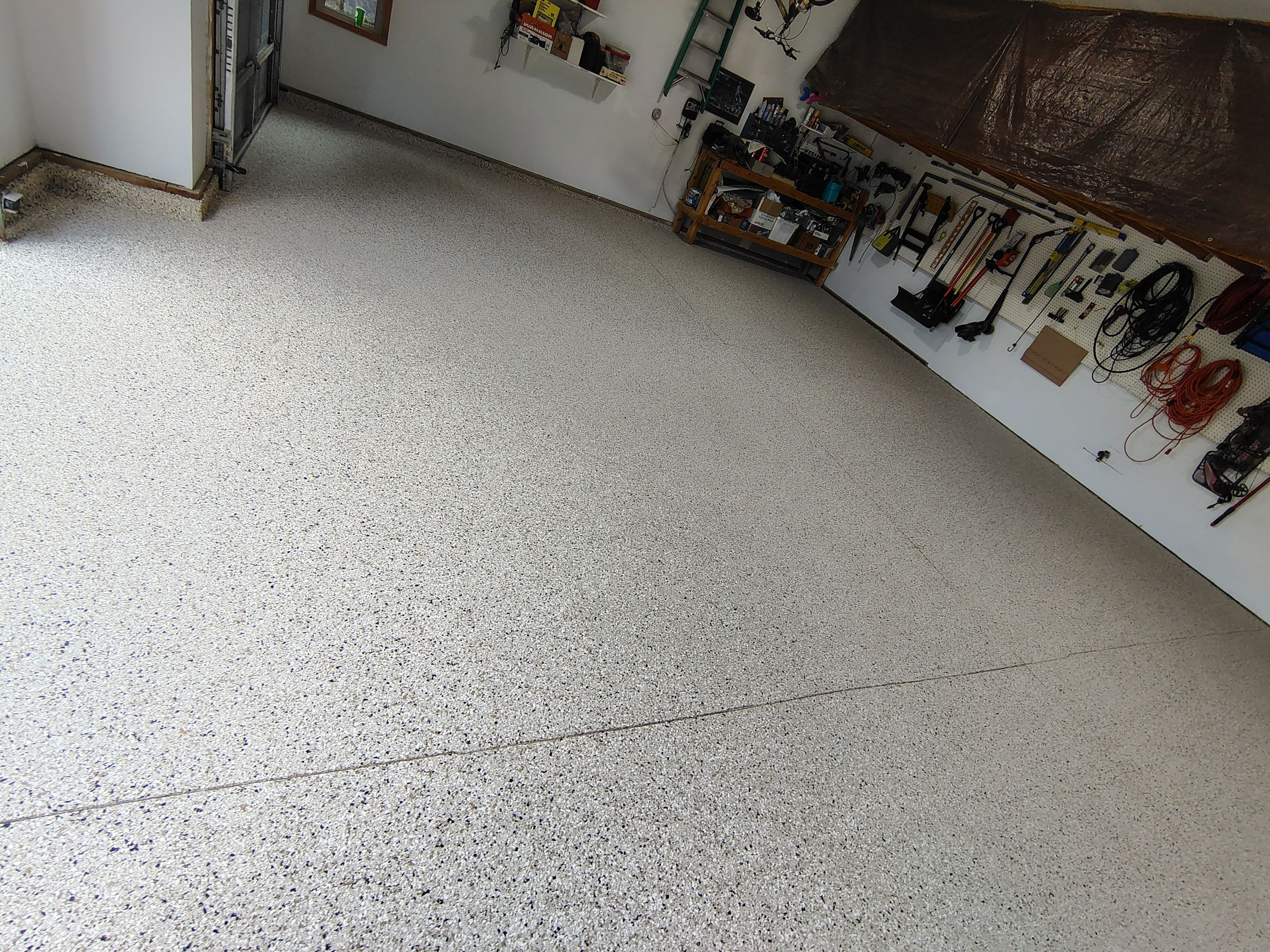 Durable Garage Floor Coating in Brandon by Select Painting, Coatings & Garage Cabinets