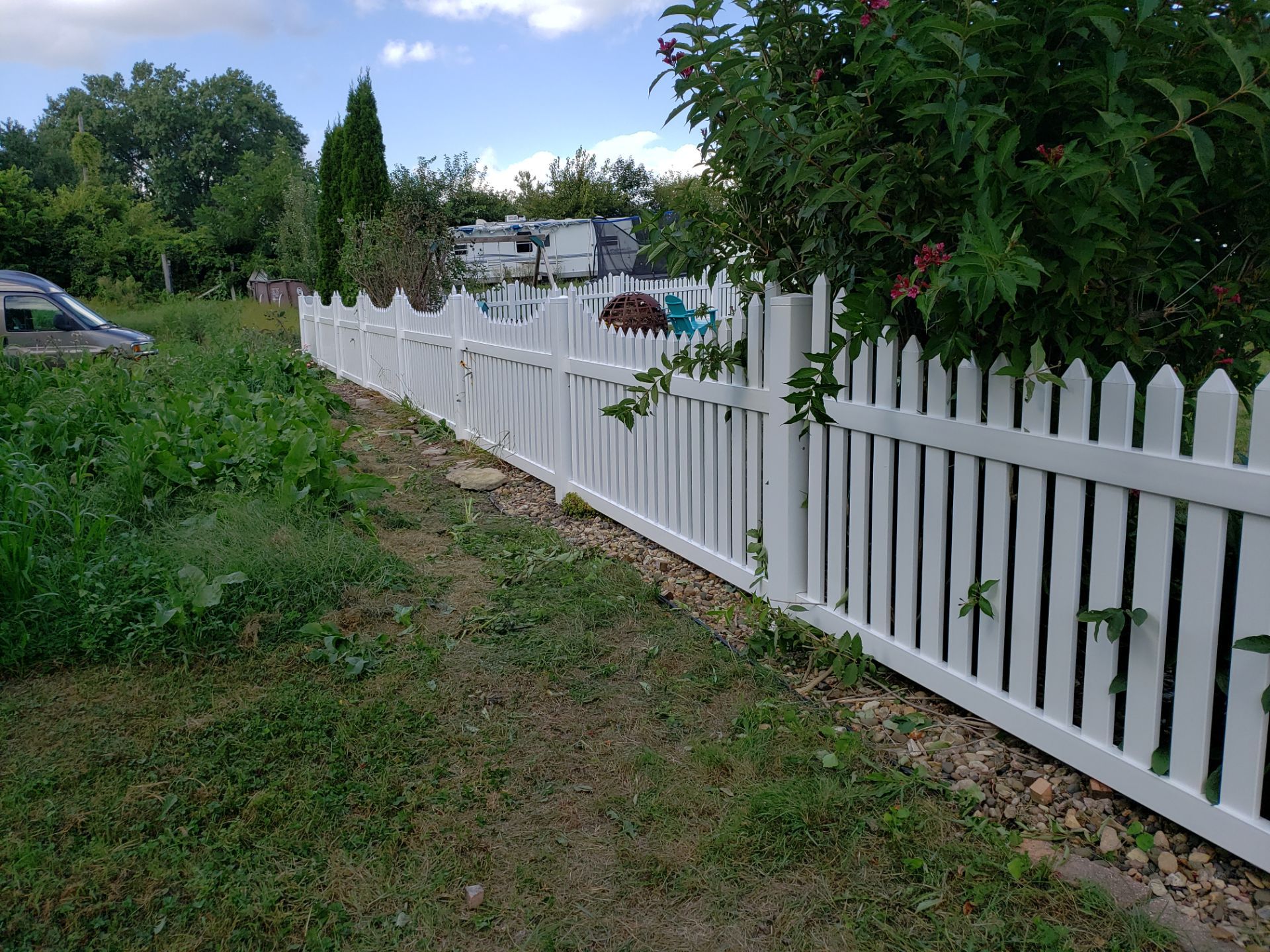 White Vinyl Spaced Picket Fence Installation in Waterloo by Perfect Picket Fence and Stain