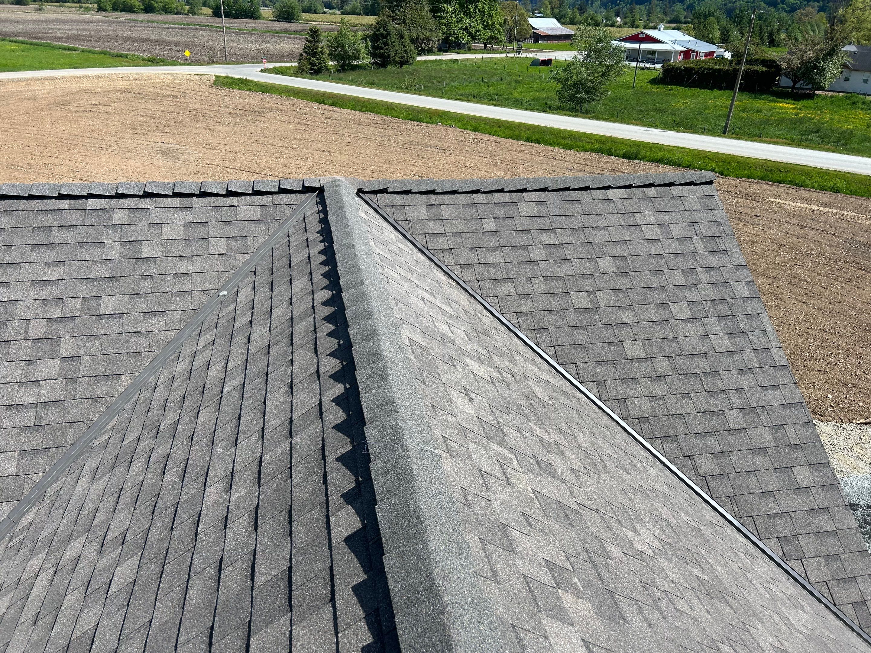 Residential Roofing Installation upgraded venting and hip and ridge capping by Top Notch Roofing Inc