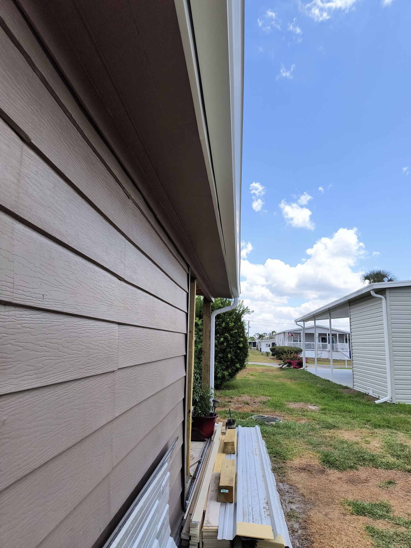 6 Inch Seamless Gutters using 3X4 Elbow Downspout in Venice FL by Gutter Professors