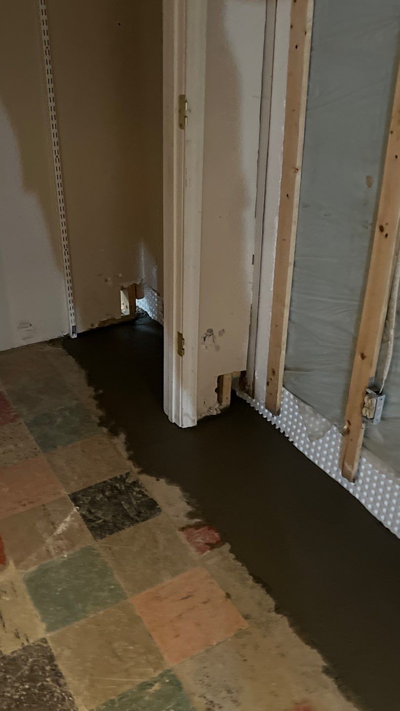 Interior drain tile system installation by ACE Waterproofing & Basement Solutions