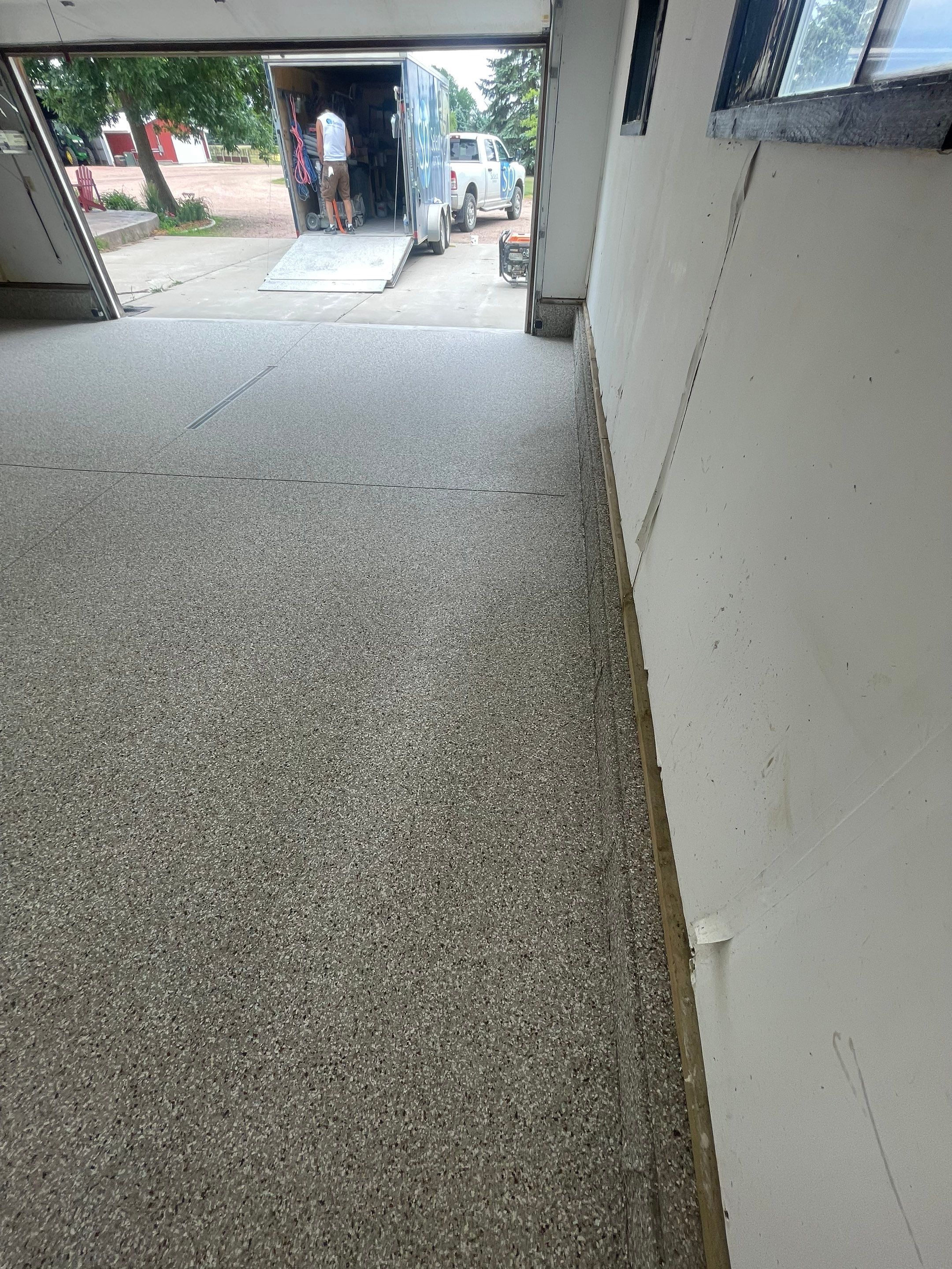 Hartford Residential Garage Floor Transformation With Decorative Chip Coating by Select Painting, Coatings & Garage Cabinets