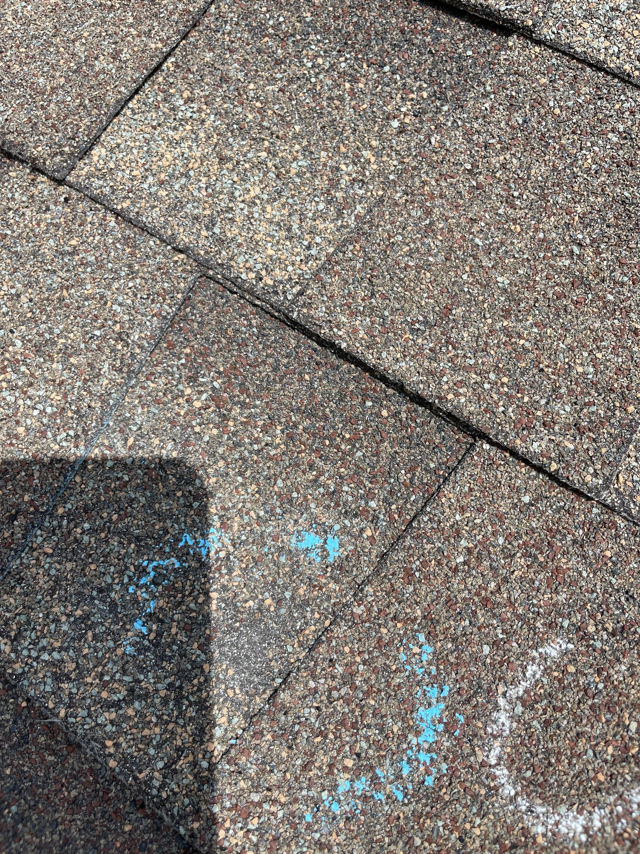 Hail Damage on a Roofing System by Icon Roofing And Construction 