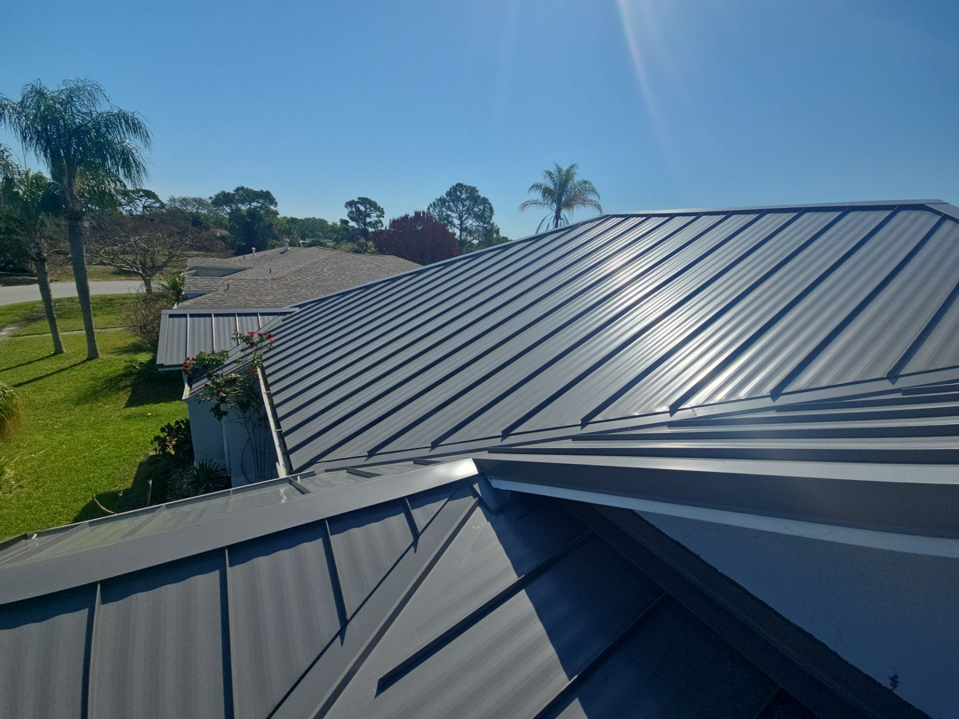 Complete Metal Roof Replacement and Seamless Gutter Installation in Melbourne by Wiedmann Construction & Roofing