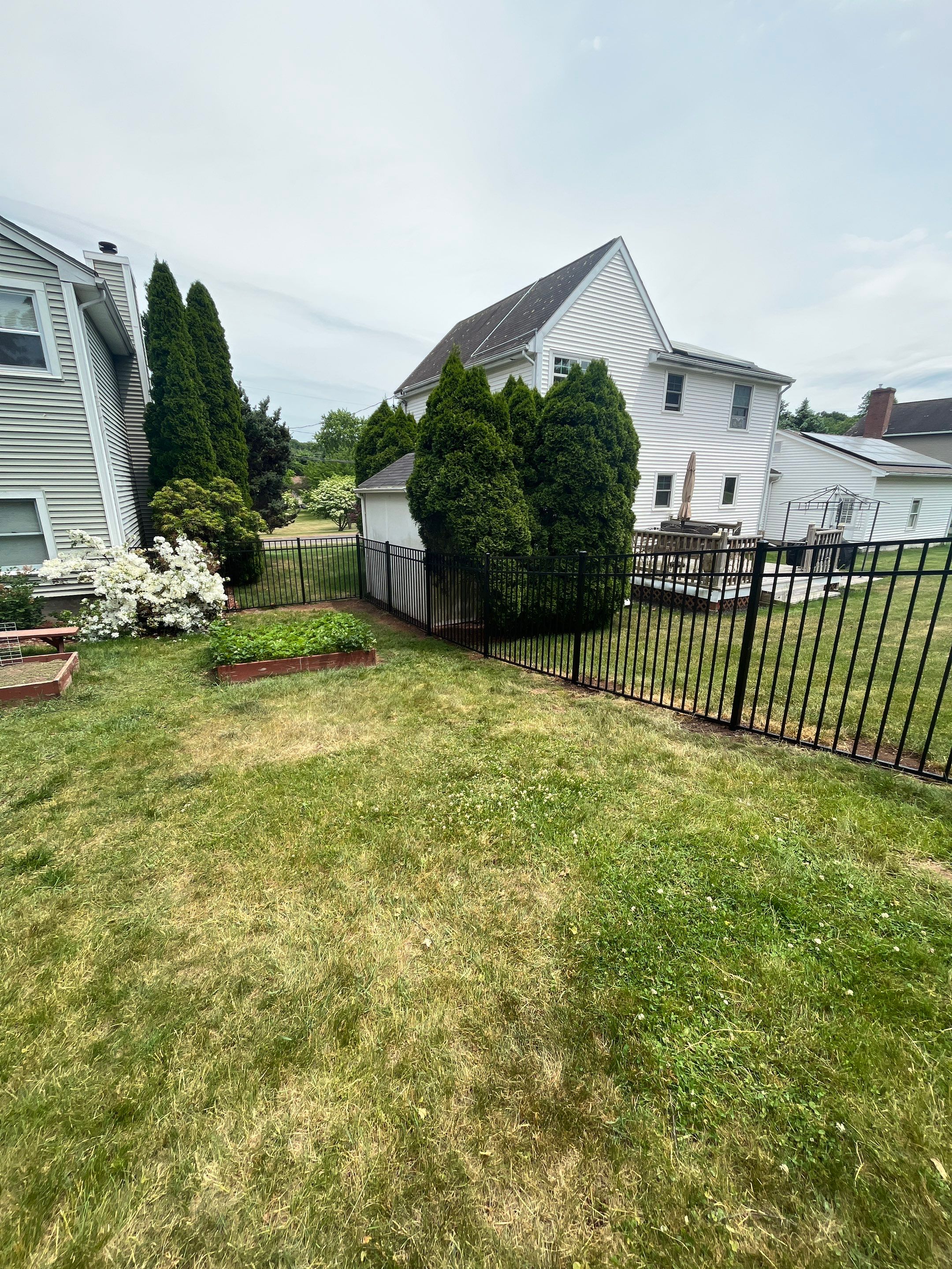 Aluminum Fence in Black, with matching Arched gate by DiGiorgi Roofing and Siding Inc