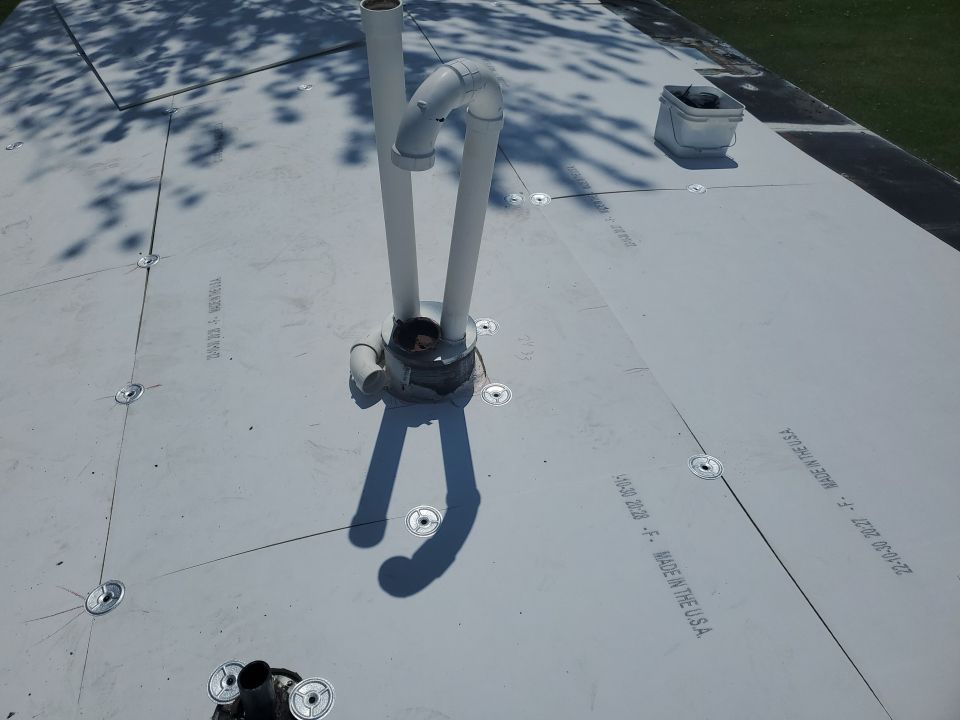 Residential Roofing Installation using 60 mil rubber roof  by Nitro Roofing and Construction