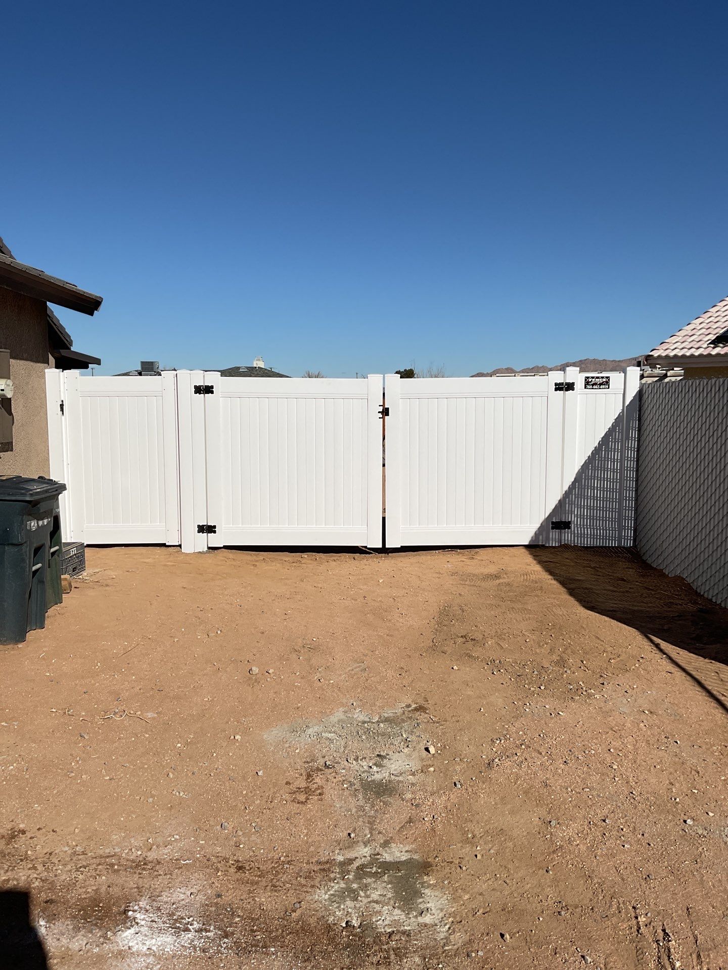 Gate installation using Vinyl by Fence Guys Inc. 