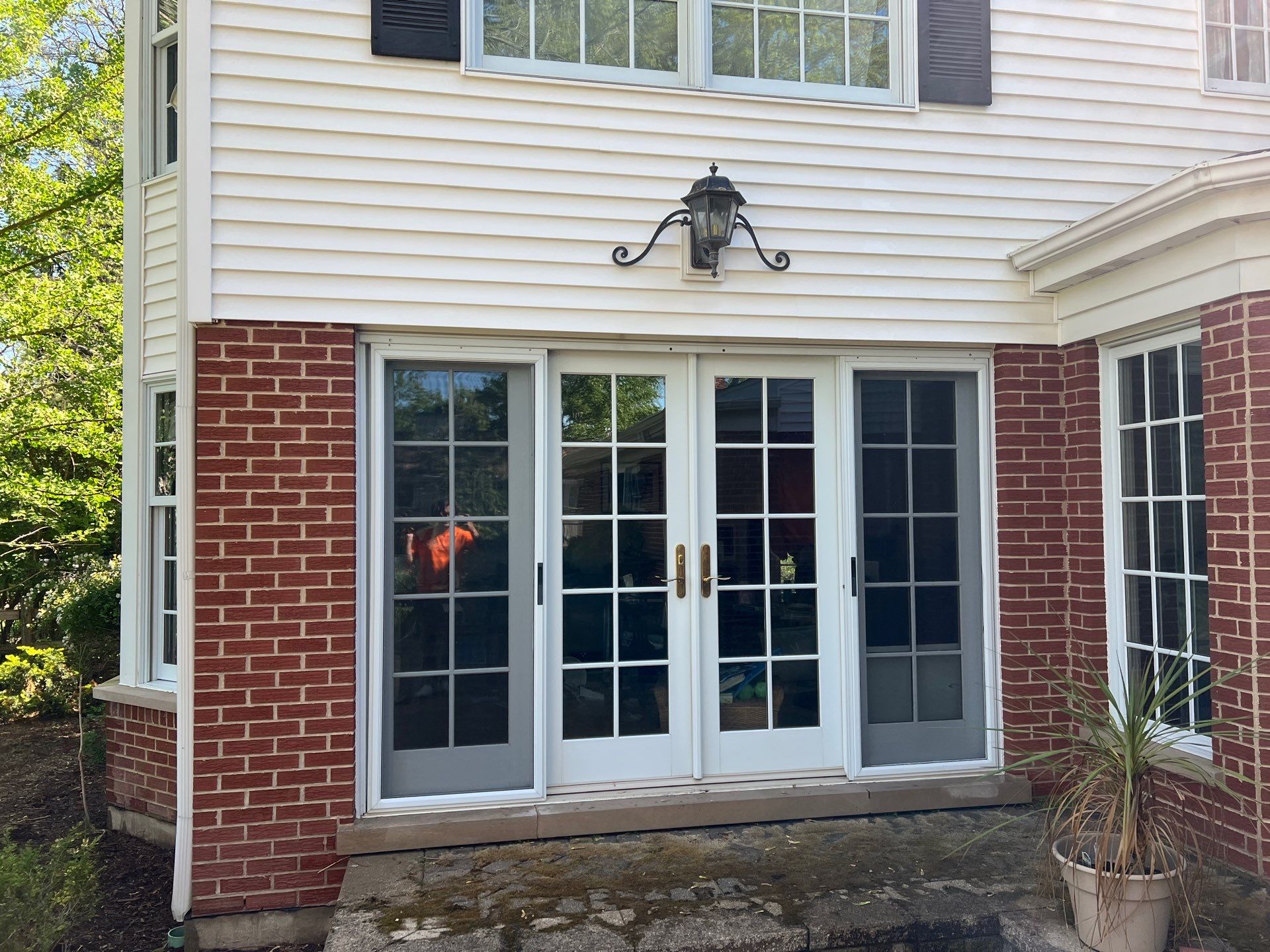 Housewashing  using Algaecide, soft wash soap by Northern Power Washing LLC.