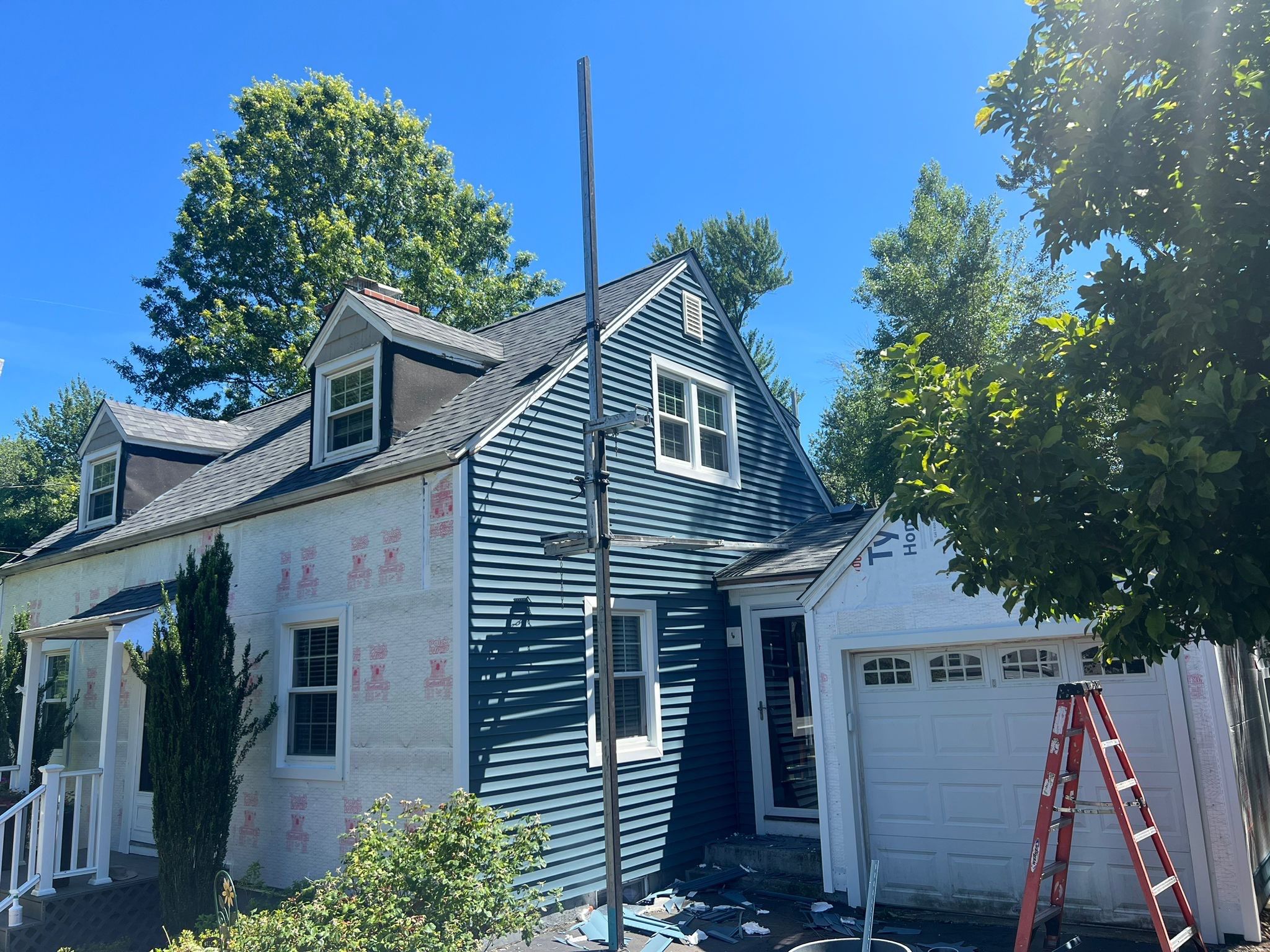 Complete Exterior Estate gray with Pacific Blue Siding by A Plus Exterior