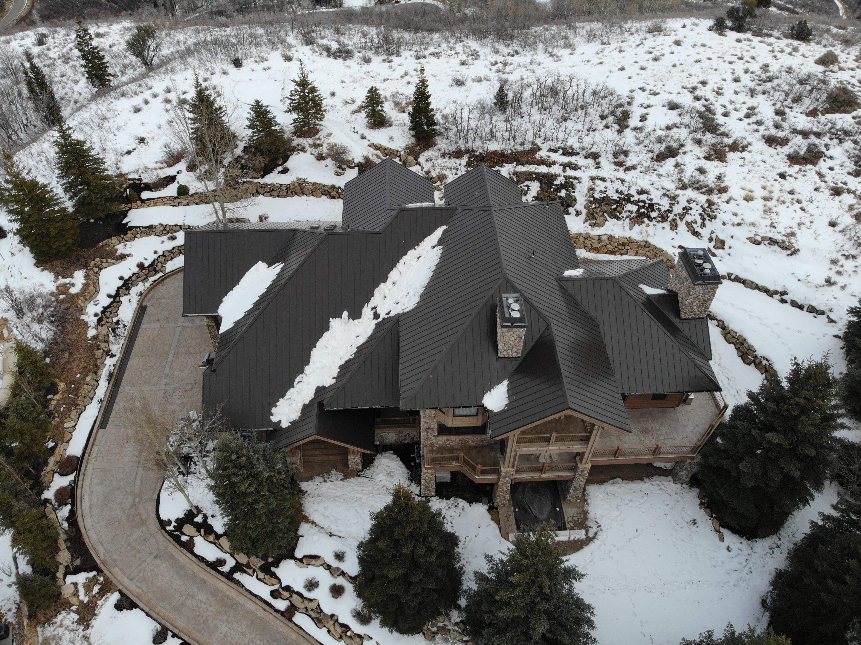 Standing Seam Metal Roof Replacement After Snow Damage by ASAP Roofing & Restoration