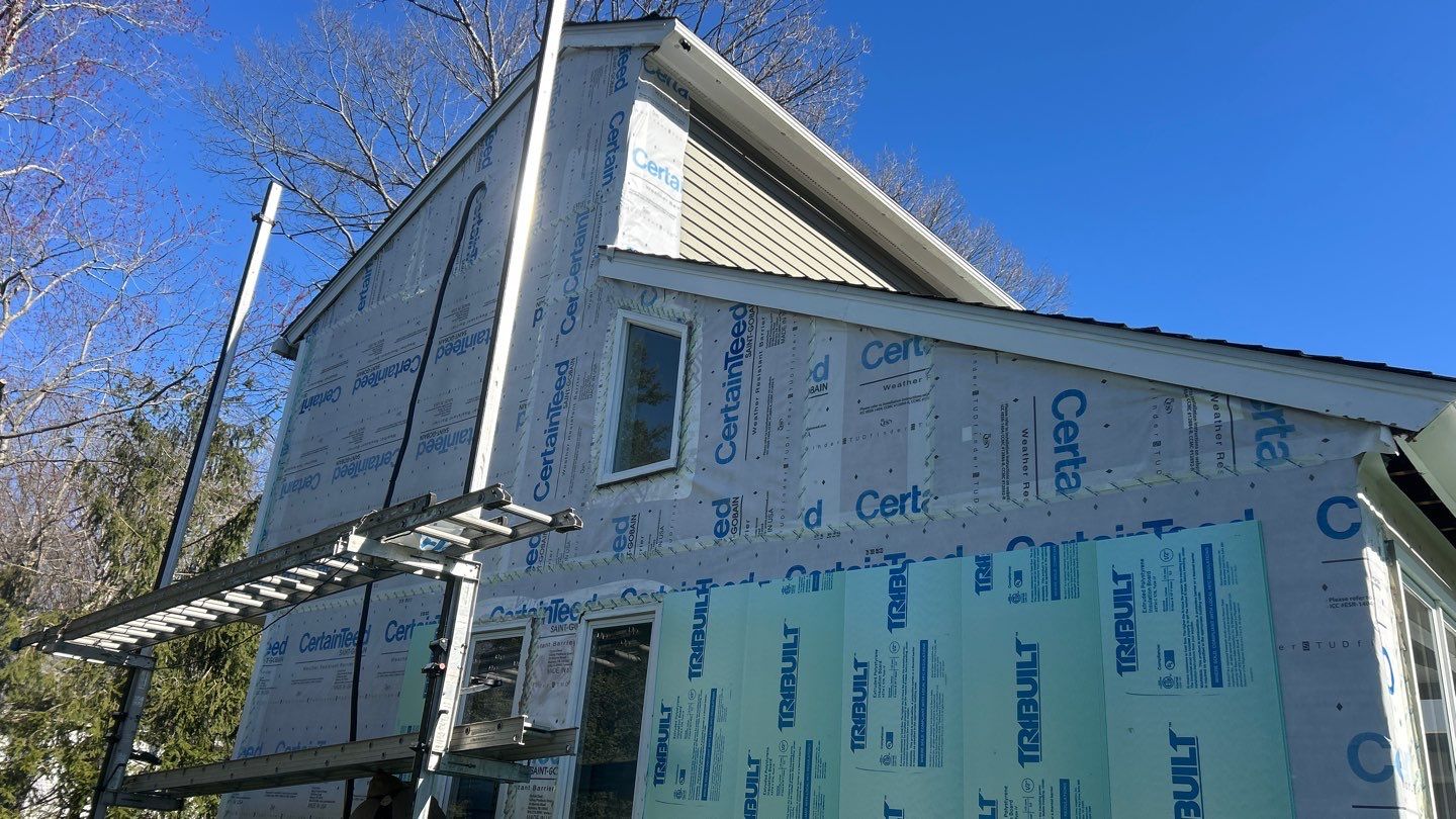 Siding transformation with Cert Monogram D/4 x16'8" clapboard Slate & Cert Monogram D/4 x 25' clapboard Slate by DiGiorgi Roofing and Siding Inc