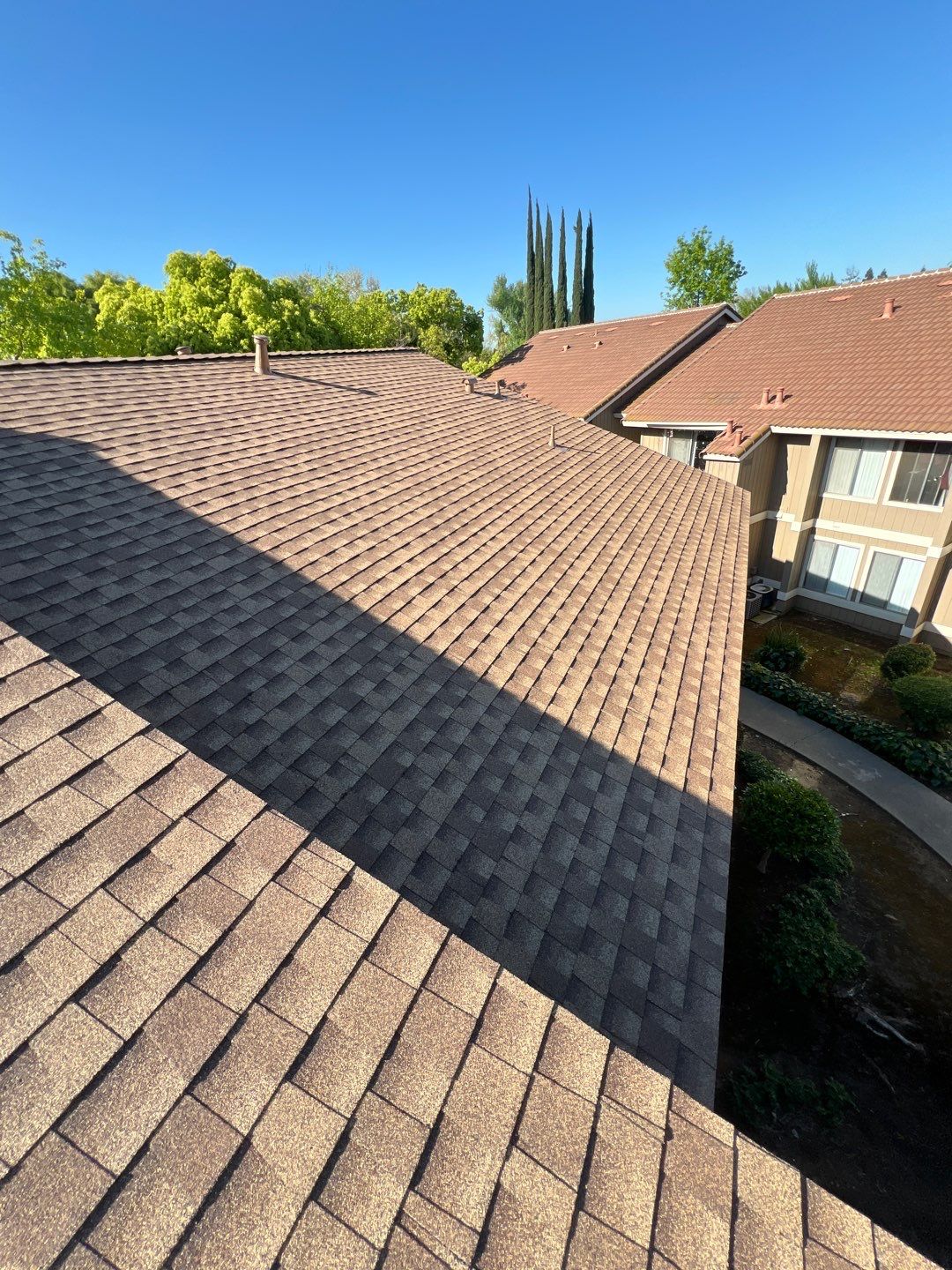 Removed tile from roof and replaced with shingles by Straight Edge Roofing Inc