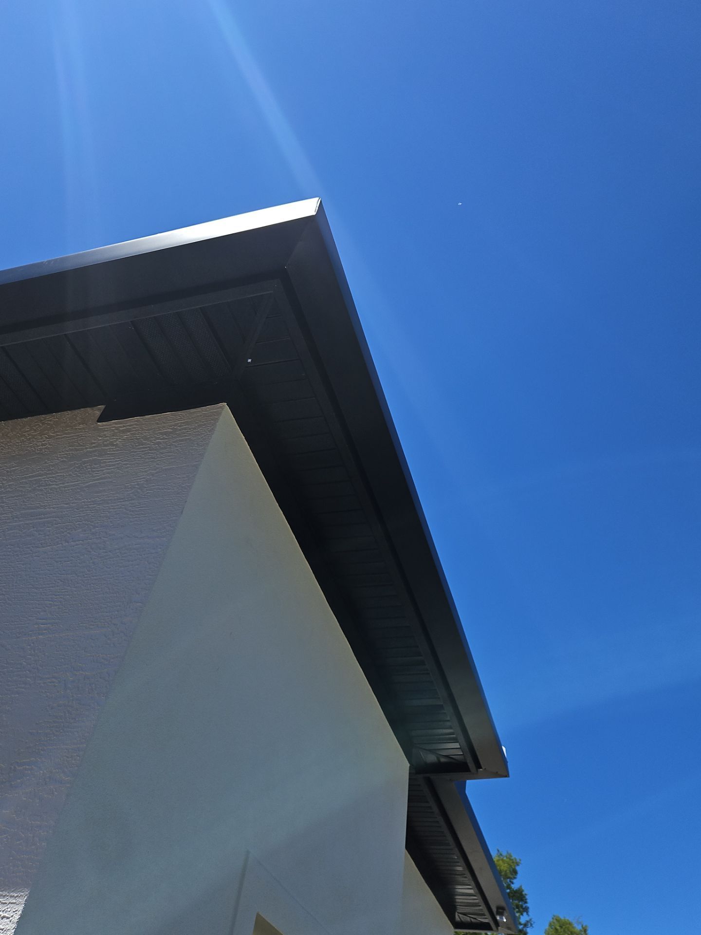 Soffit and Fascia Installation and black seamless gutters in Sarasota FL by Gutter Professors