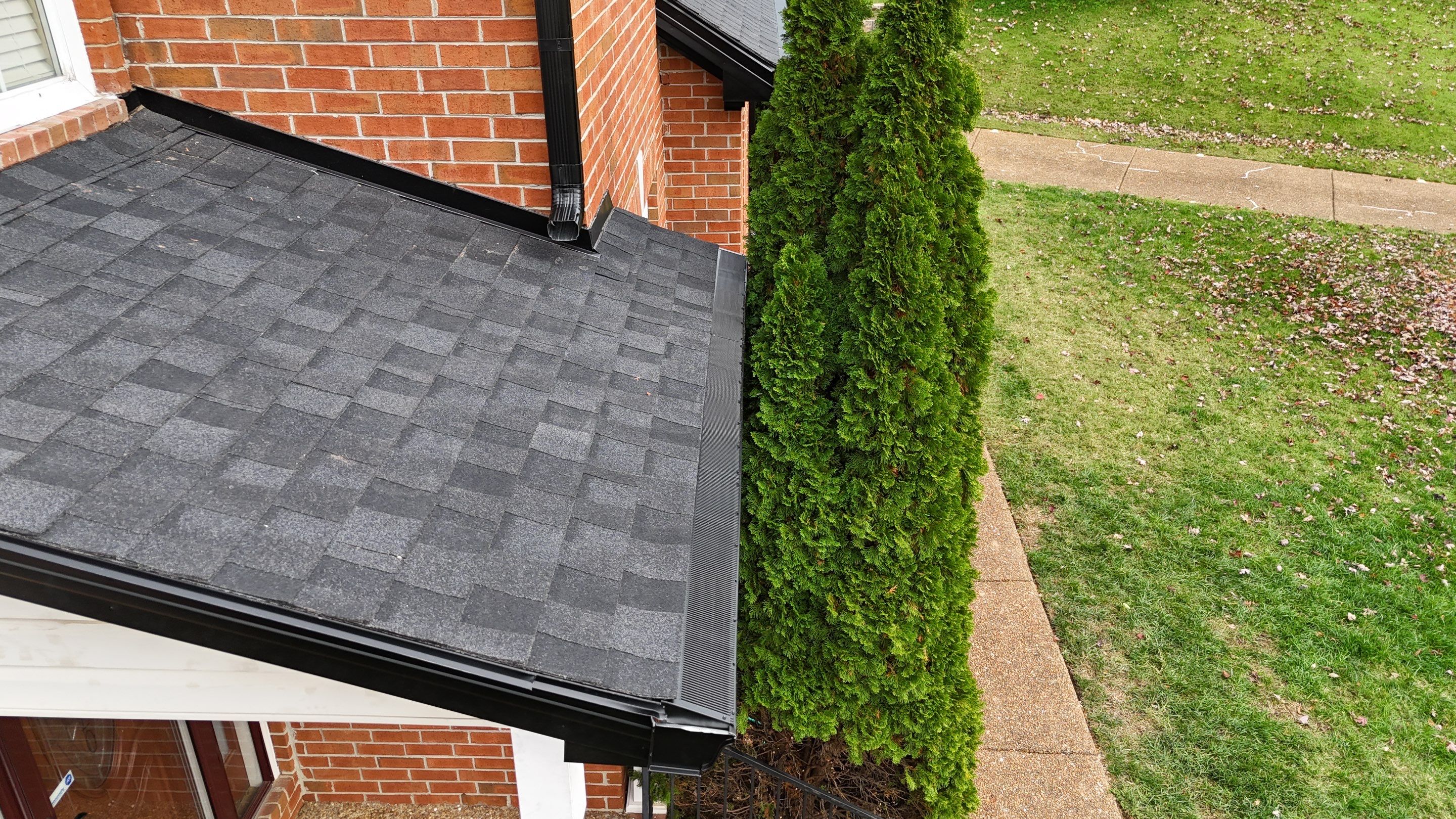 Charcoal Black Re-Roof & Gutters by Royal House LLC