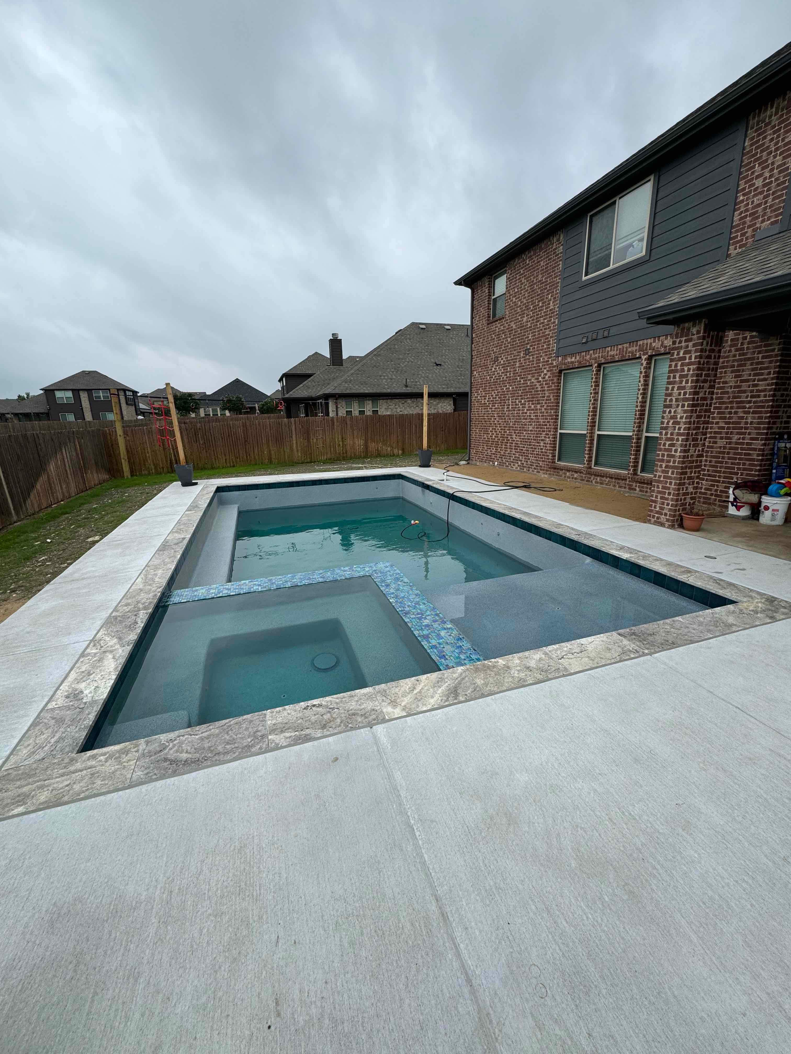 Geometric Pool with Tanning Ledge by Pinnacle Pools and Spas - DFW