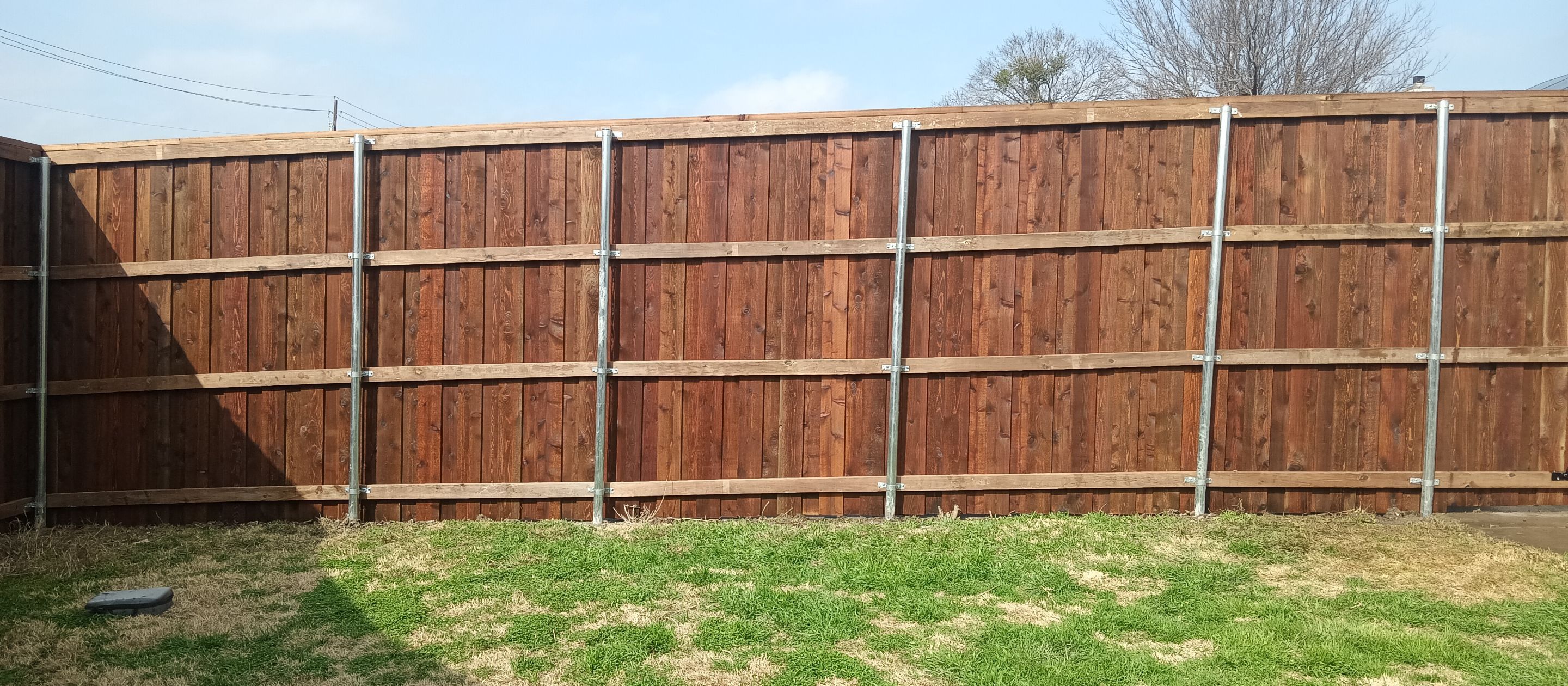Pre-Stained 8' Board on Board cedar w/ trim and cap  by Grizzly Fence And Patio