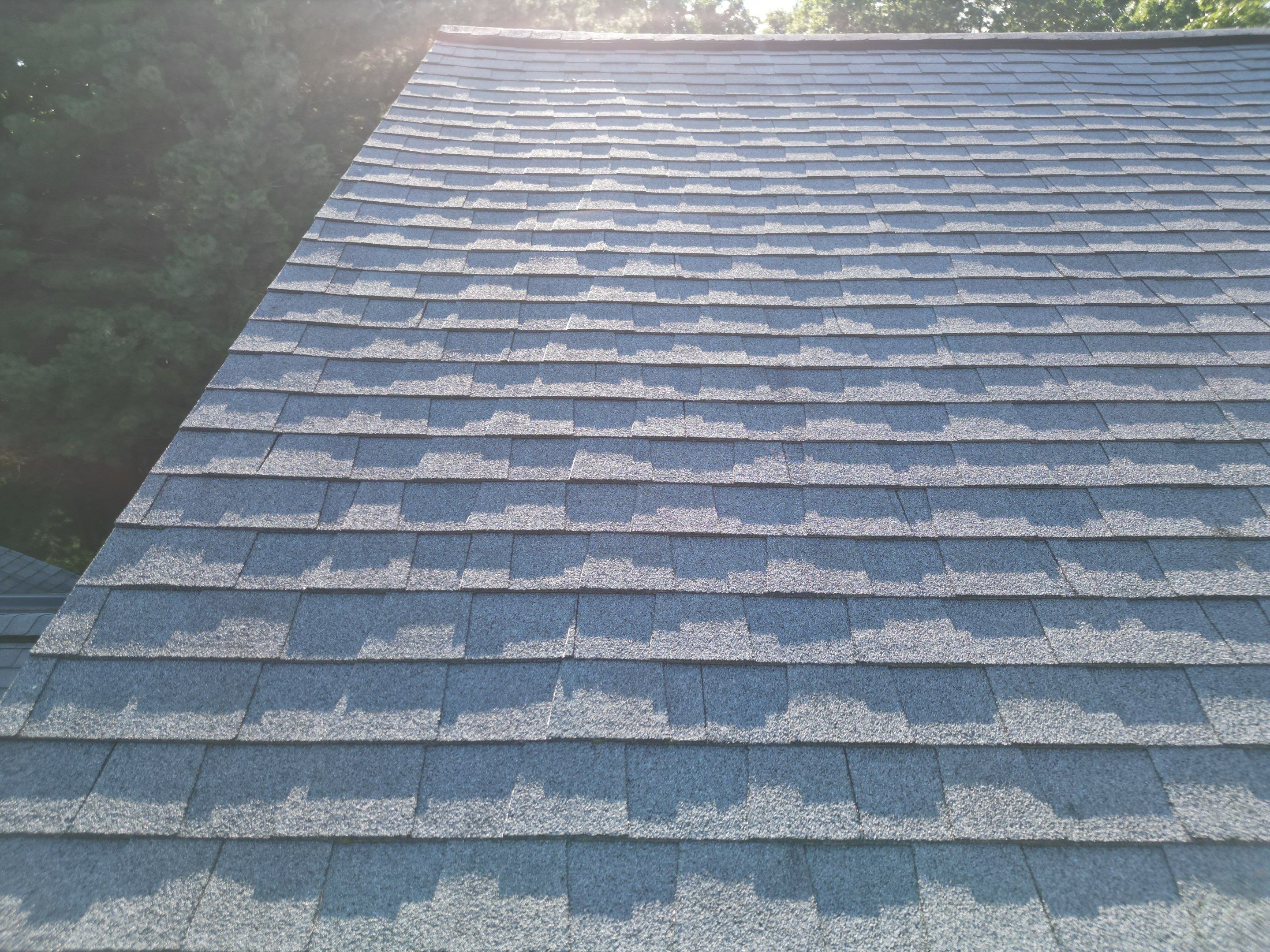Complete Roof Replacement with Chimney Flashing, Gutter Guard System, and Vinyl Siding Repairs by Mighty Dog Roofing of Greater Middlesex County