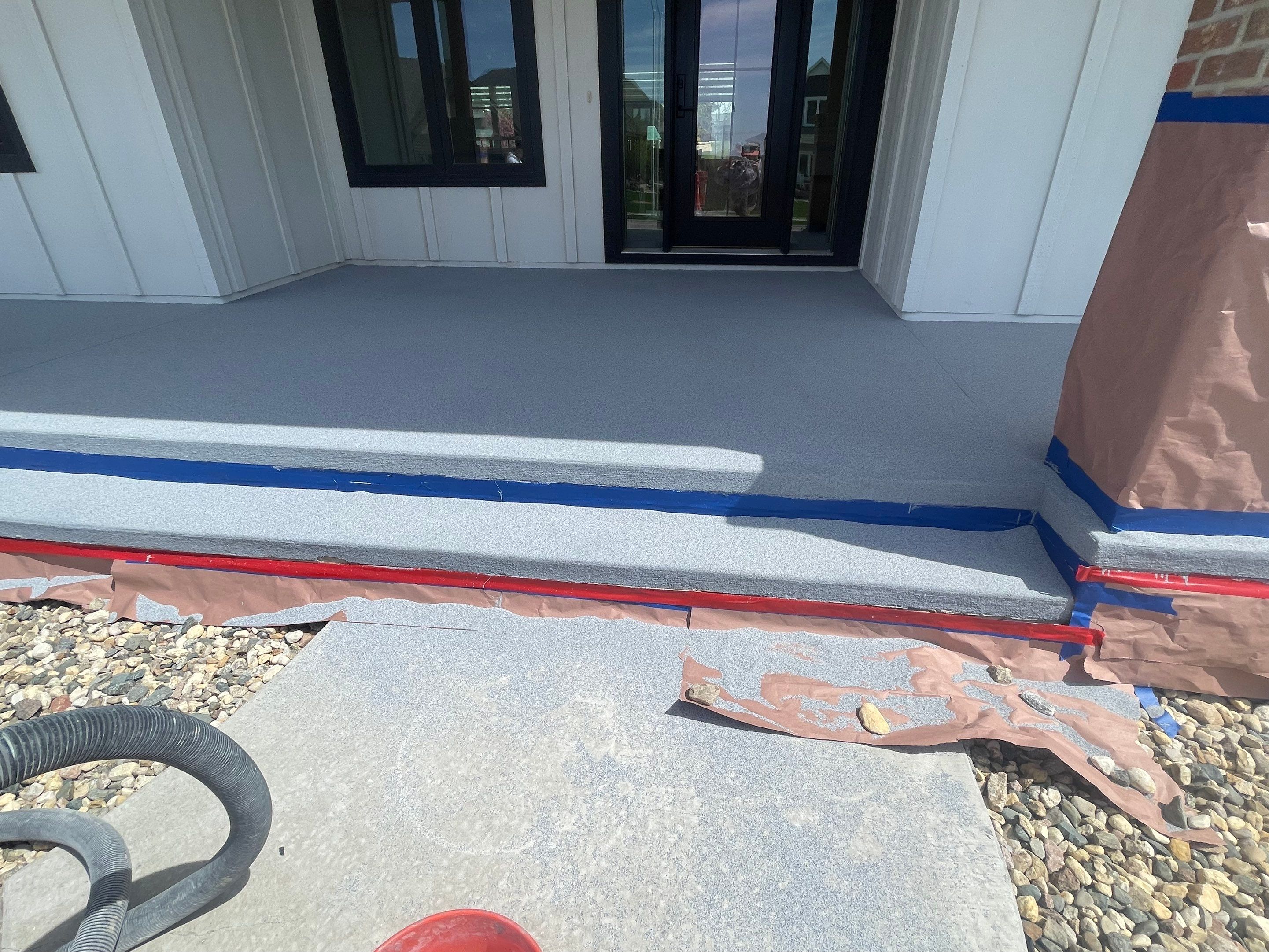 Grey Speckled Concrete Porch Coating for Sioux Falls Home by Select Painting, Coatings & Garage Cabinets