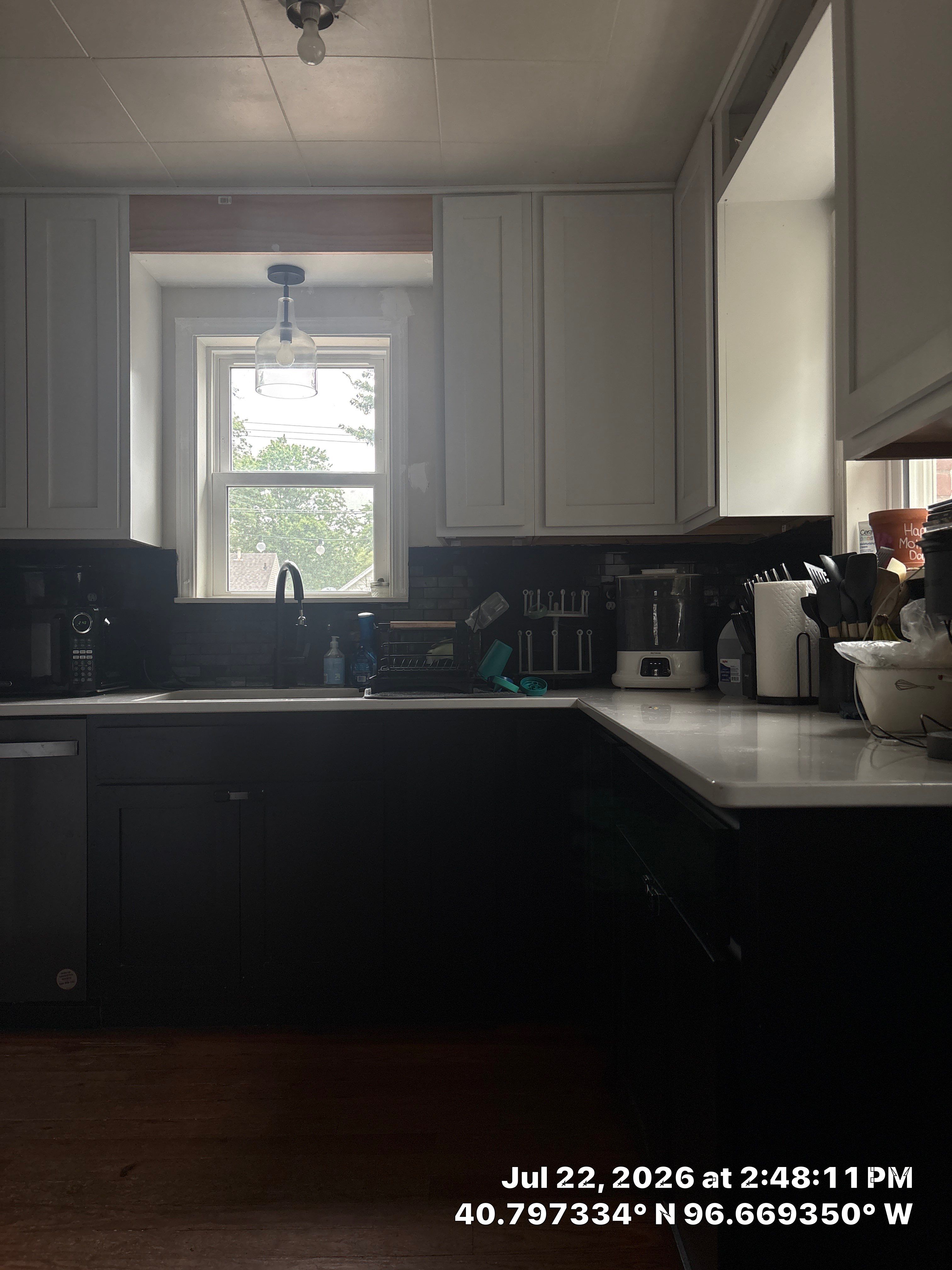 Modern Kitchen Renovation with Two-Tone Cabinetry and Quartz Countertops by CompanyCam Sales Demo