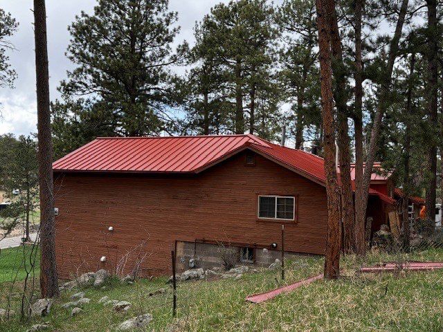 Residential Roofing Installation using Standing Seam Metal by Blue Peaks Roofing LLC 