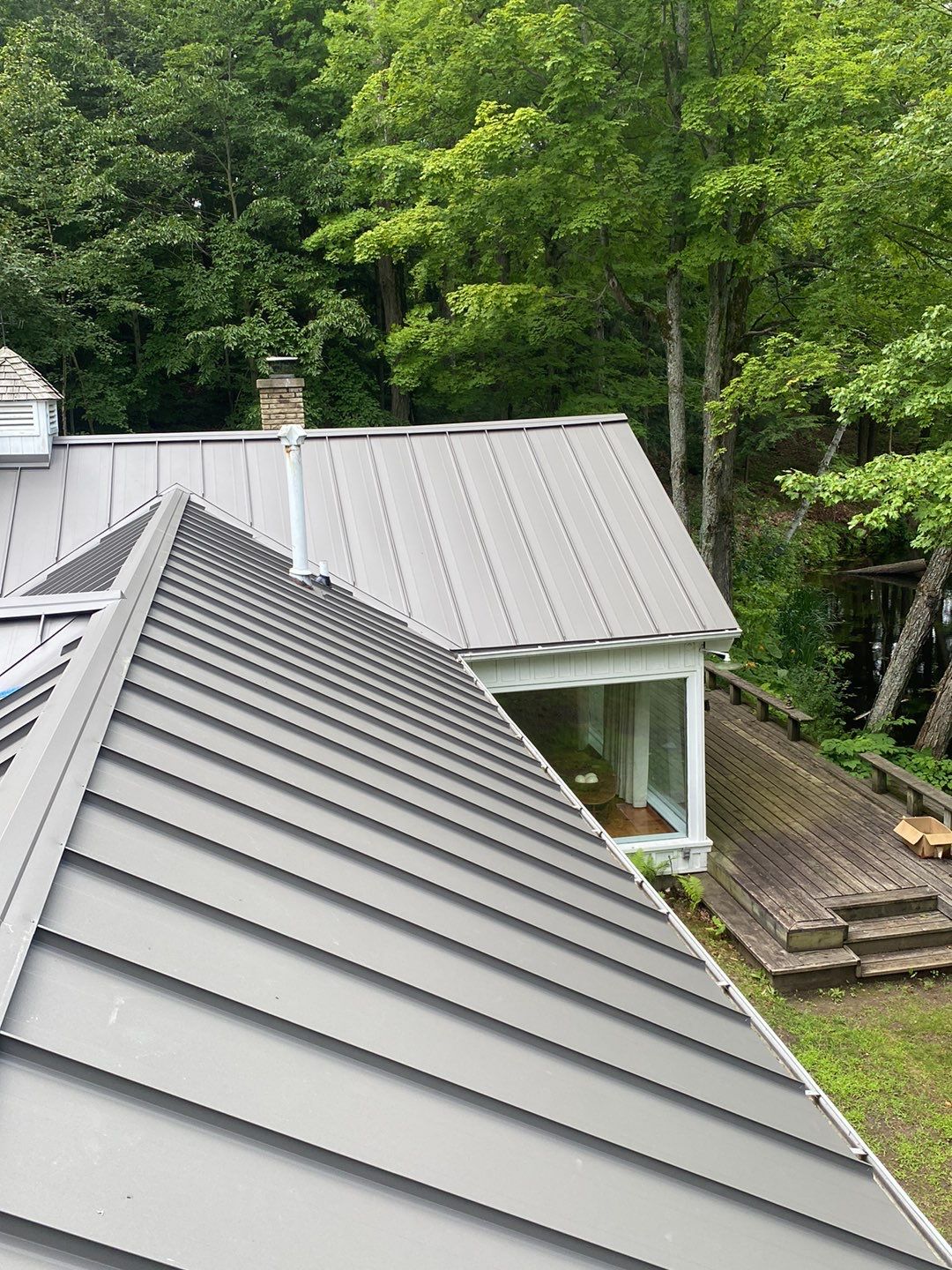 Residential Roofing Installation using 24 Ga Standing Seam Meta by Jay Carter Roofing & Sheet Metal