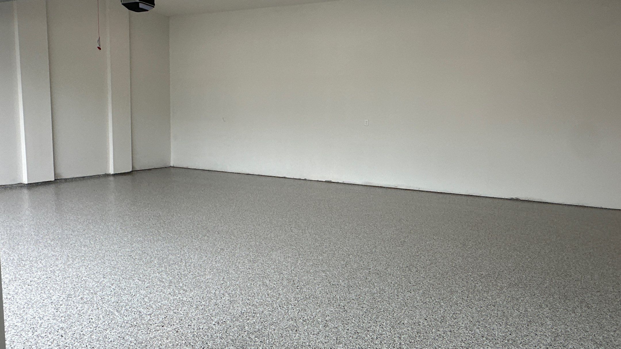 Jon S. transformed his garage with a new floor, slotwall & Cabinets! by Banner Garage